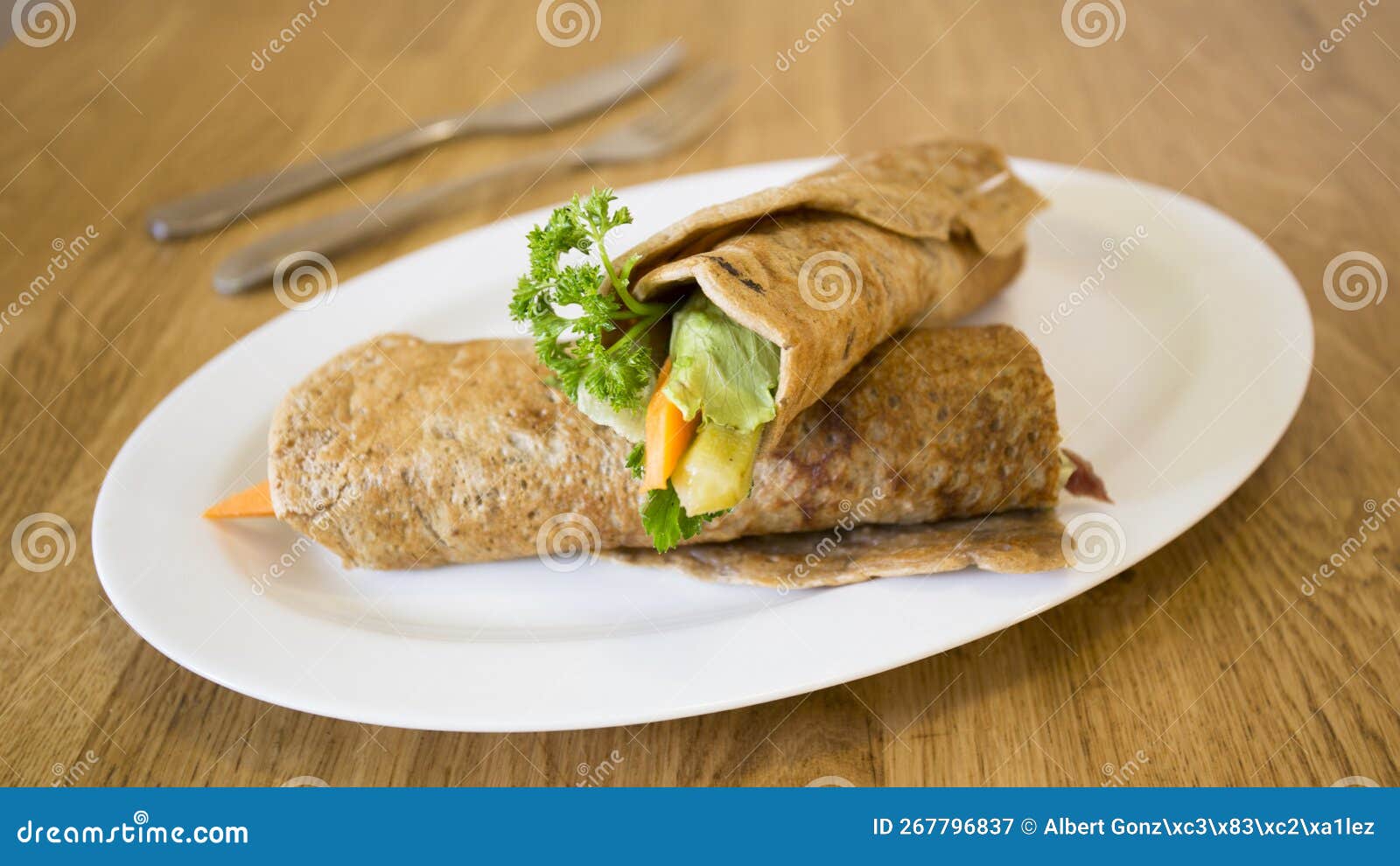 goraasa roll with vegetables. goraasa is a sudanese pancake or flatbread that is fluffy, versatile, soft and doughy.
