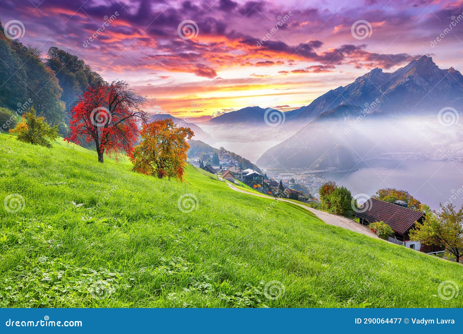 gorgeous autumn view on suburb of stansstad city and lucerne lake with mountaines and fog