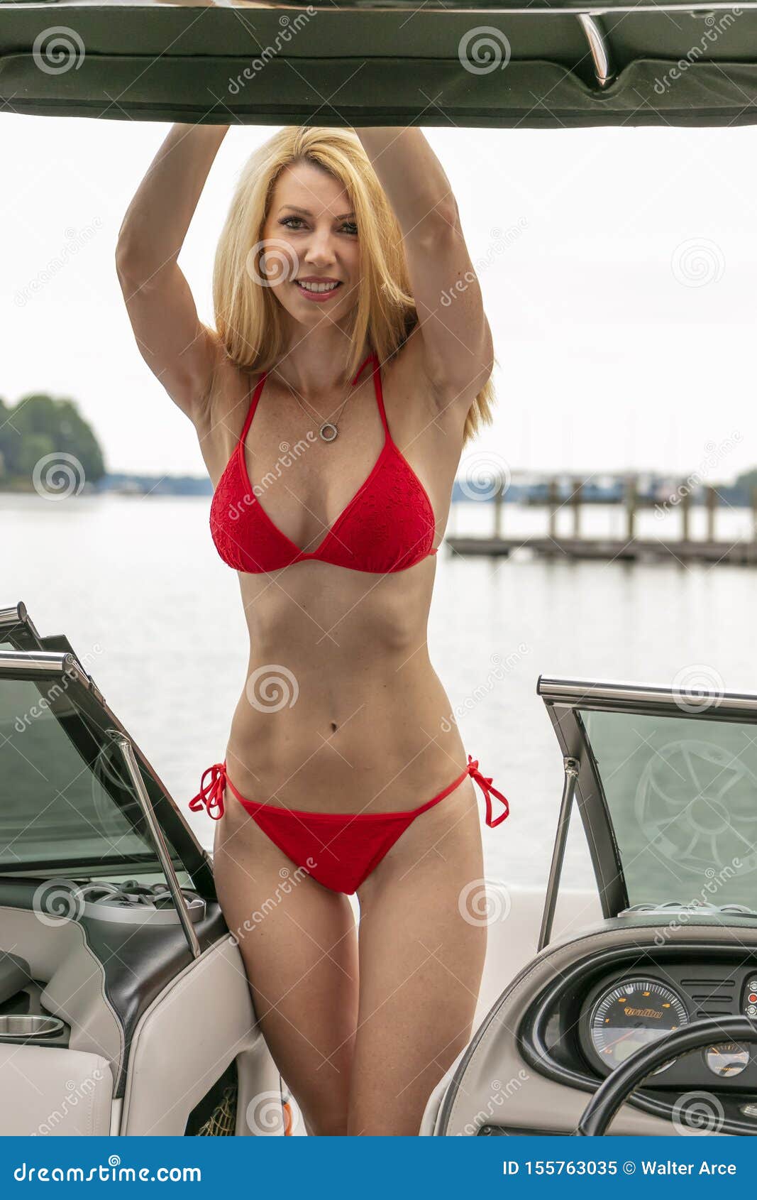 Beautiful Bikini Model Relaxing On A Boat By The Docks Stock Image Image Of Beautiful