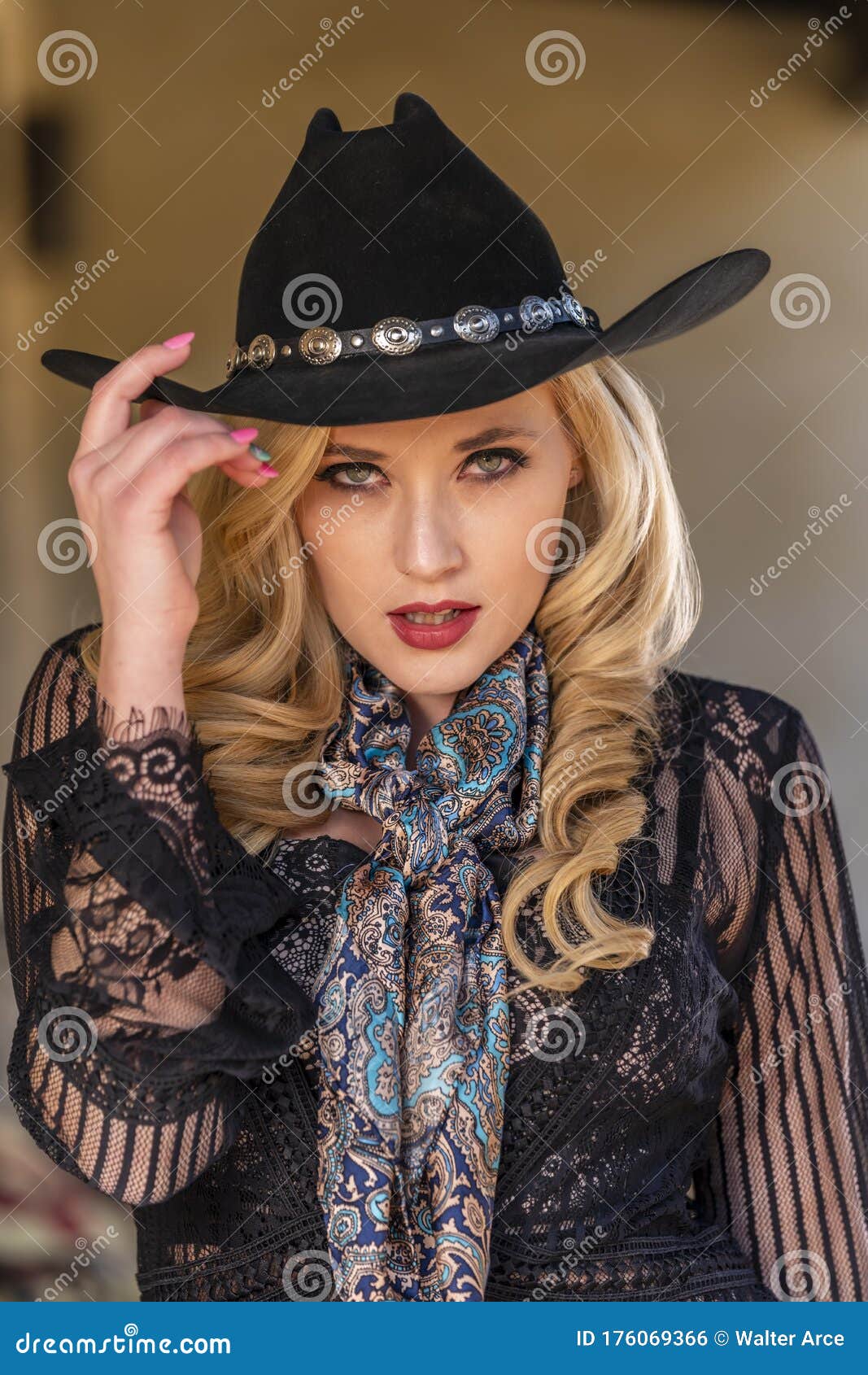 A Lovely Blonde Model Dressed As a Cowgirl Enjoys the American West ...