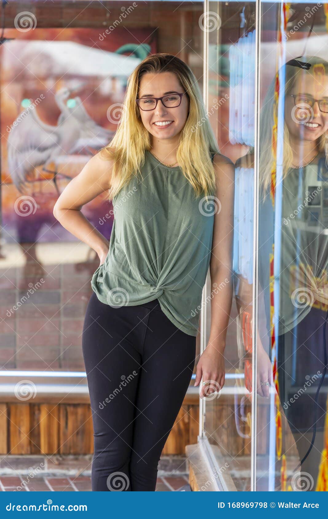 A Lovely Blonde Model Enjoys An Autumn Day Outdoors In A Small Town