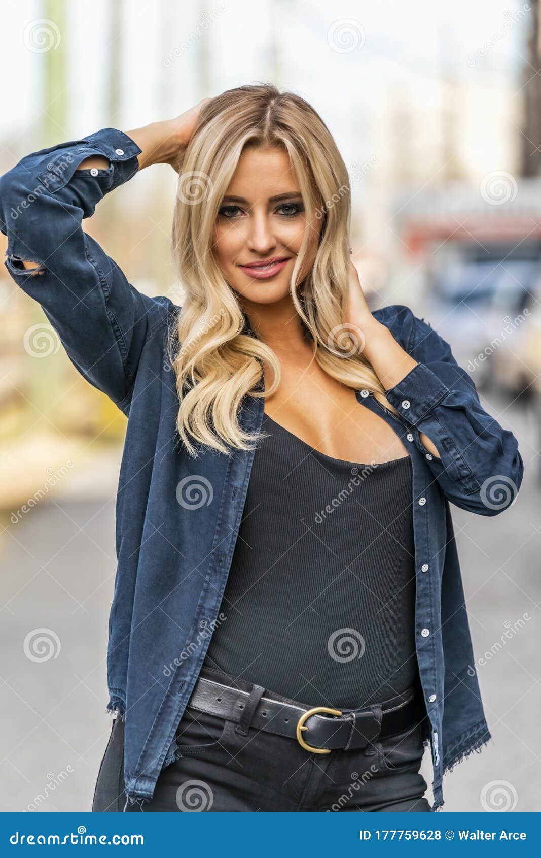 A Lovely Blonde Model Enjoys An Autumn Day Outdoors In A Small Town