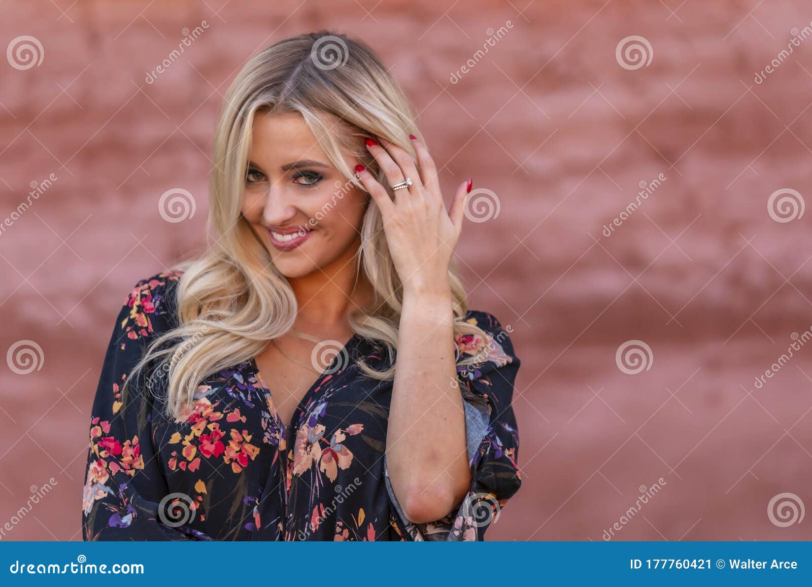 A Lovely Blonde Model Enjoys An Autumn Day Outdoors In A Small Town