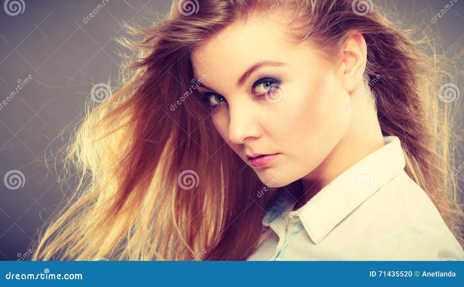 Blonde girl with wavy hair waving at the camera - wide 5
