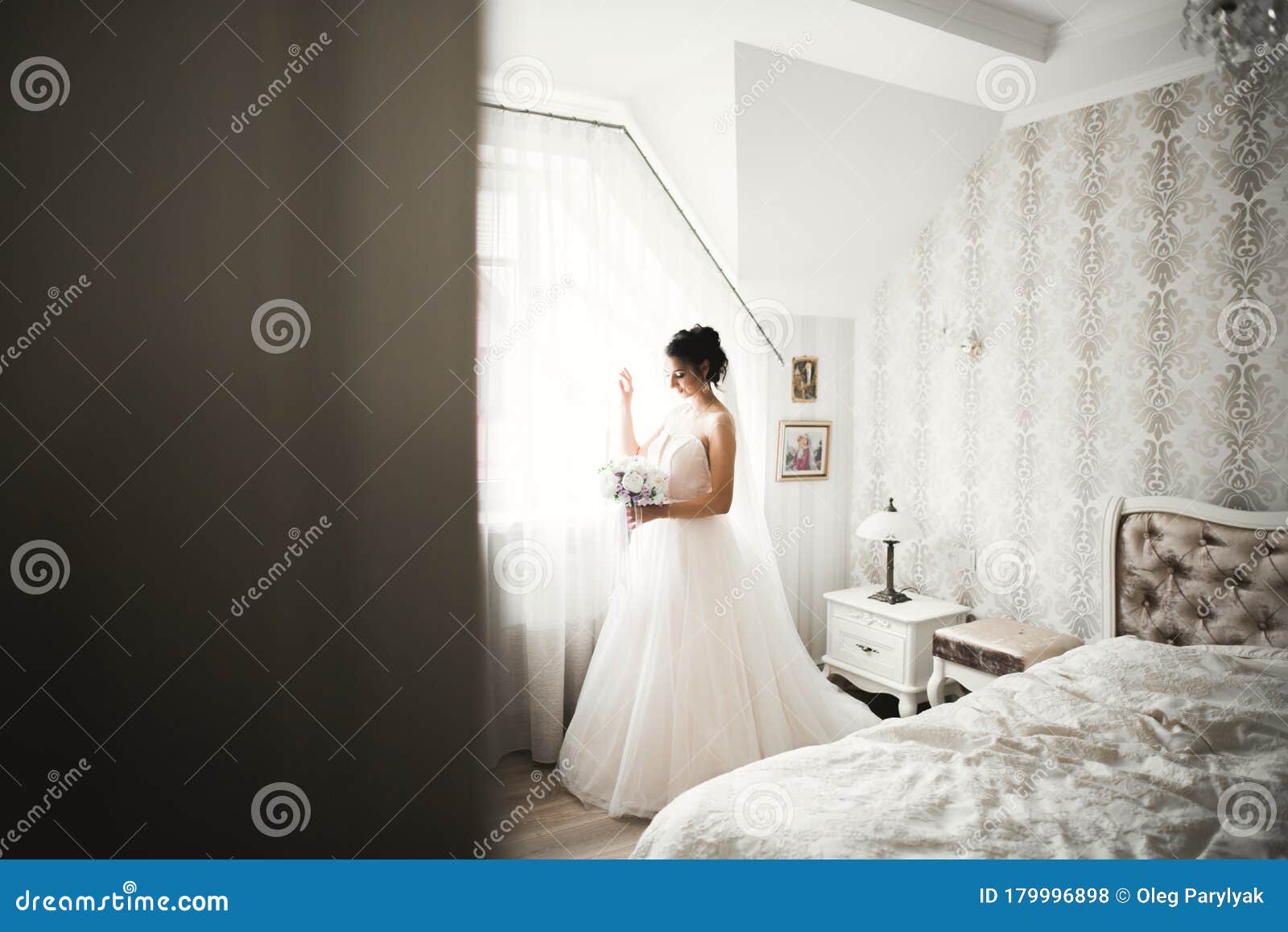 Gorgeous Bride In Robe Posing And Preparing For The Wedding Ceremony