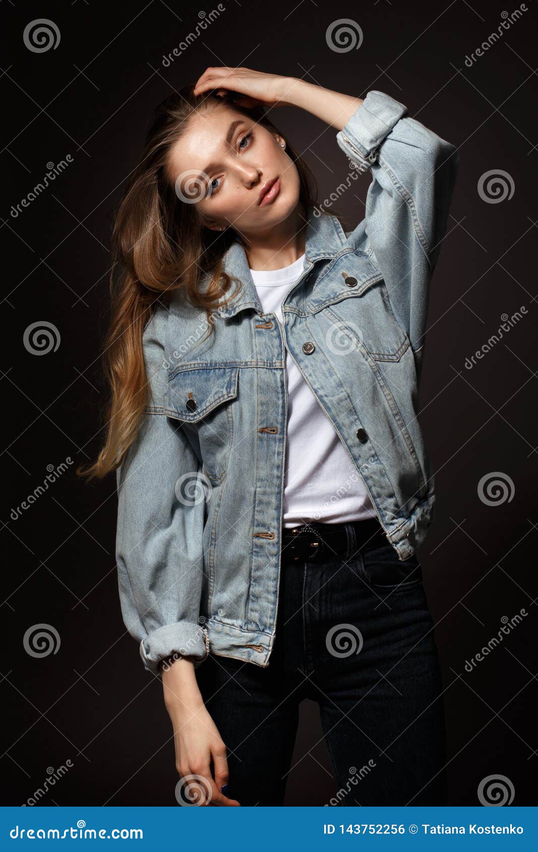 Selective Focus Photo of Woman in Blue Denim Jacket White Top and Black  Bottoms Posing In Front of White Car With Her Eyes Closed  Free Stock Photo