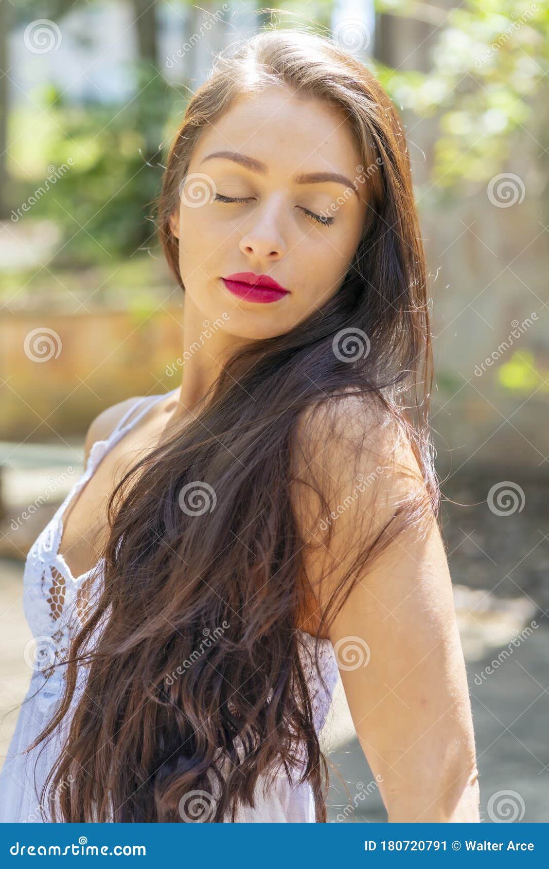 A Lovely Brunette Model Enjoys An Spring Day Outdoors Stock Image