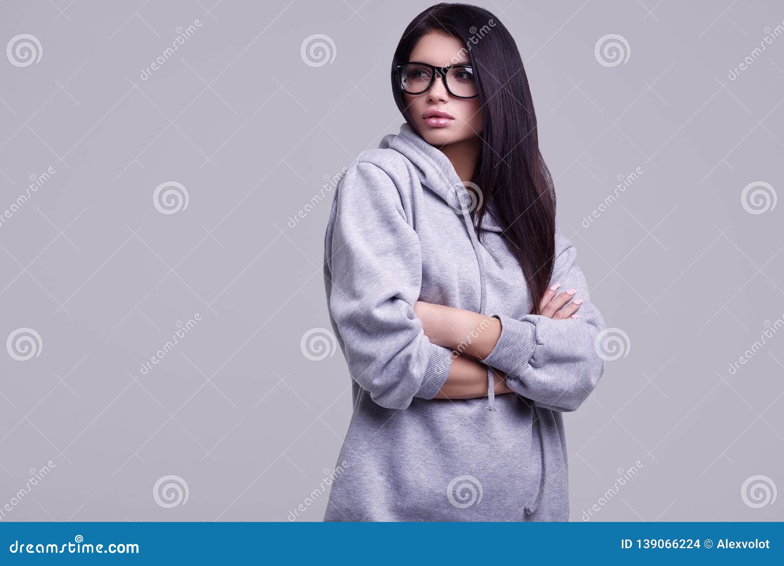 Gorgeous Brunette Woman in Fashion Blue Hoodie in Studio Stock Photo ...