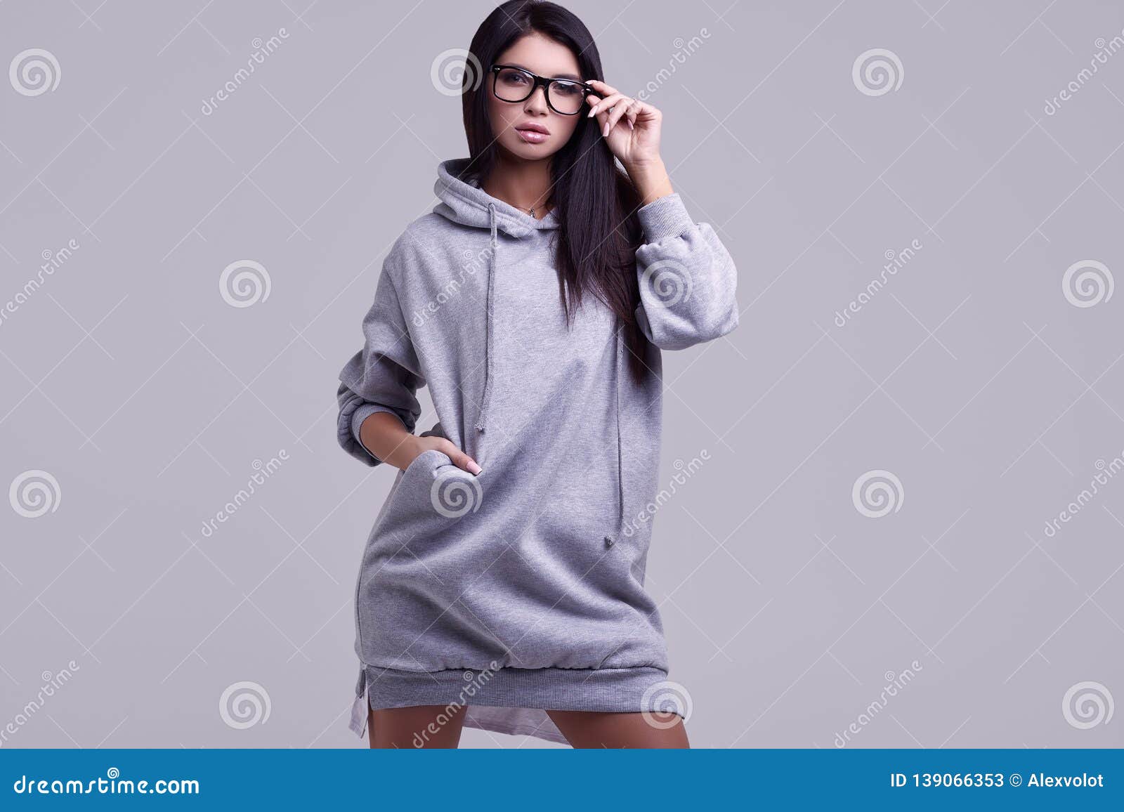 Gorgeous Brunette Woman in Fashion Blue Hoodie in Studio Stock Image ...