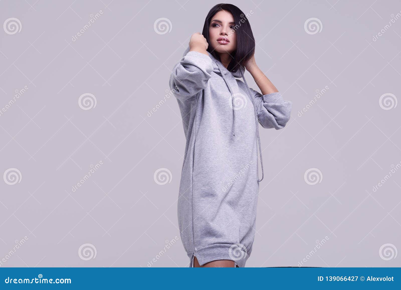 Gorgeous Brunette Woman in Fashion Blue Hoodie in Studio Stock Image ...