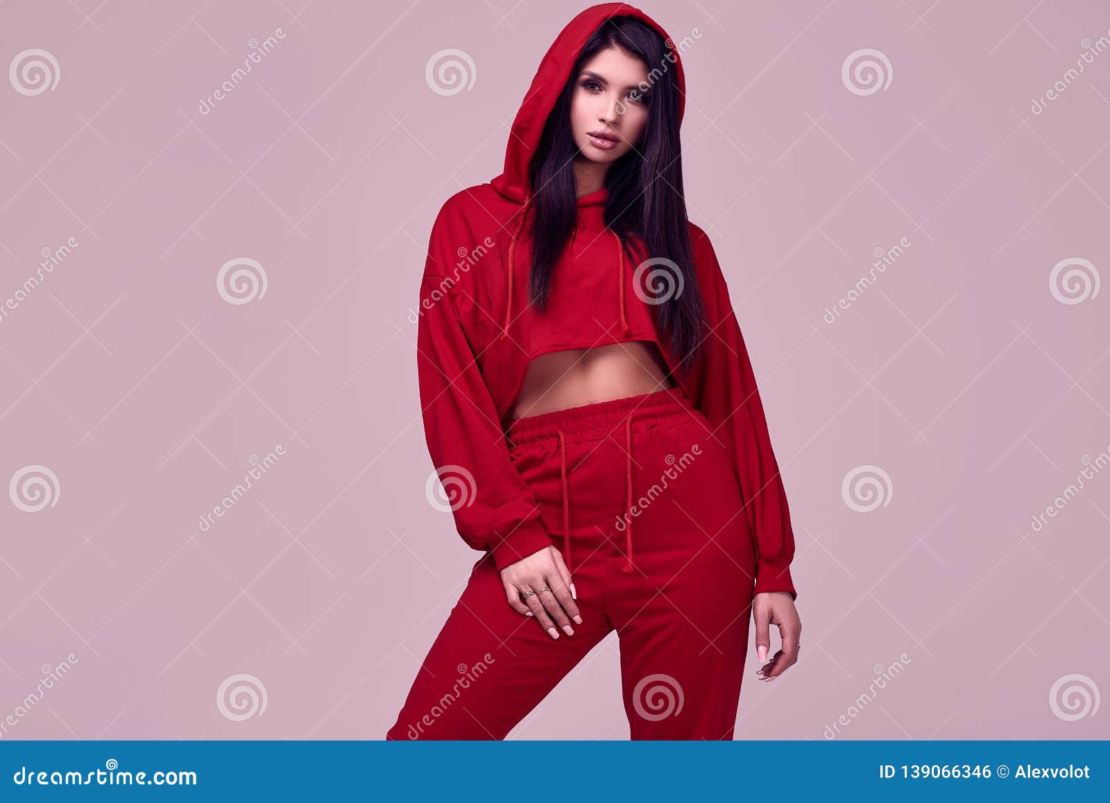 Gorgeous Brunette Woman in Fashion Red Hoodie in Studio Stock Photo ...