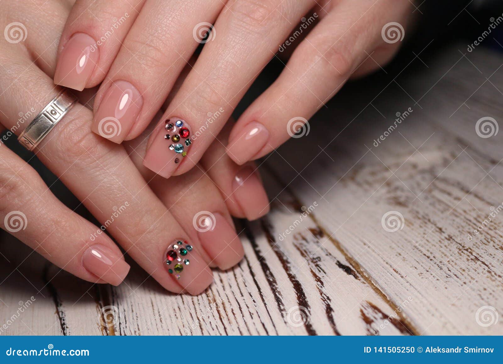 Gorgeous manicure, dark purple tender color nail polish, closeup photo. Female hands over simple background of casual clothes white pretty beautiful design woman business beauty art girl style light fashion salon