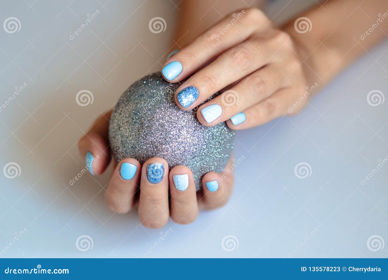 Gorgeous Manicure, Pastel Blue Color Nail Polish, Closeup Photo. Female  Hands Hold a Christmas Balls Stock Image - Image of care, christmas:  135578223