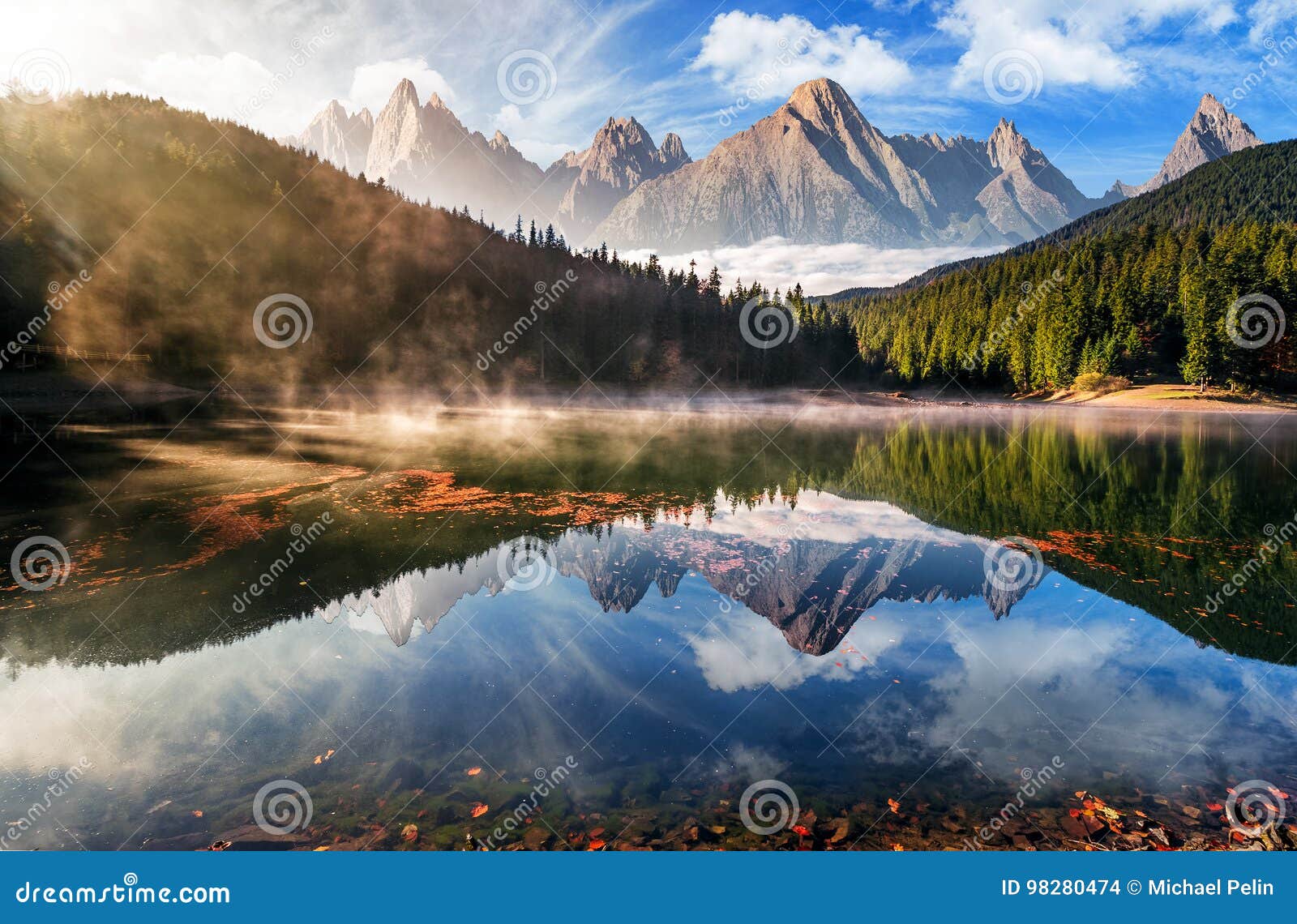 gorgeous mountain lake in autumn fog