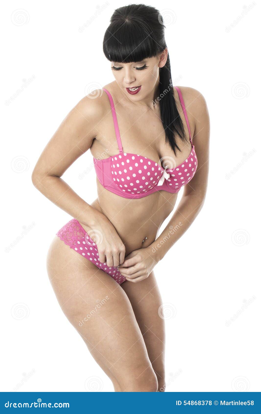 Gorgeous Cute Glamorous Pin Up Model Posing In Pink Polka