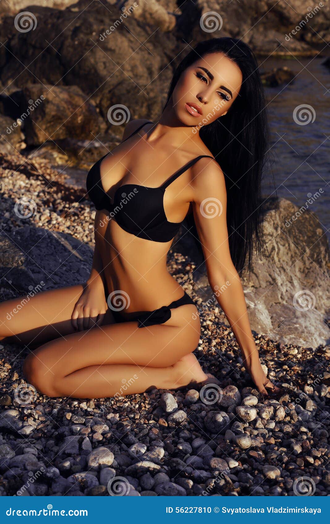 Gorgeous Woman with Dark Hair in Elegant Black Bikini Stock Photo