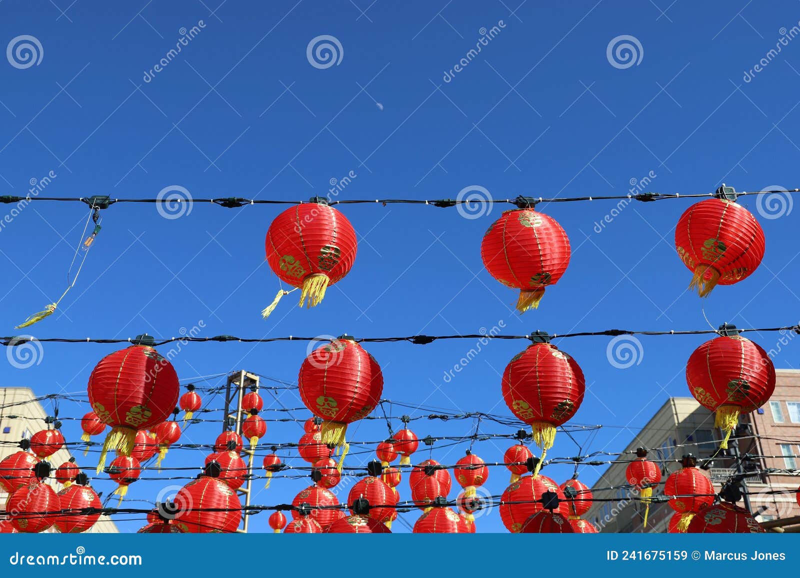 A Gorgeous Shot of Rows of Red Chinese Lanterns Hanging from Black Cables  with a Blue Sky Background at Atlantic Station Stock Image - Image of china,  celebration: 241675159