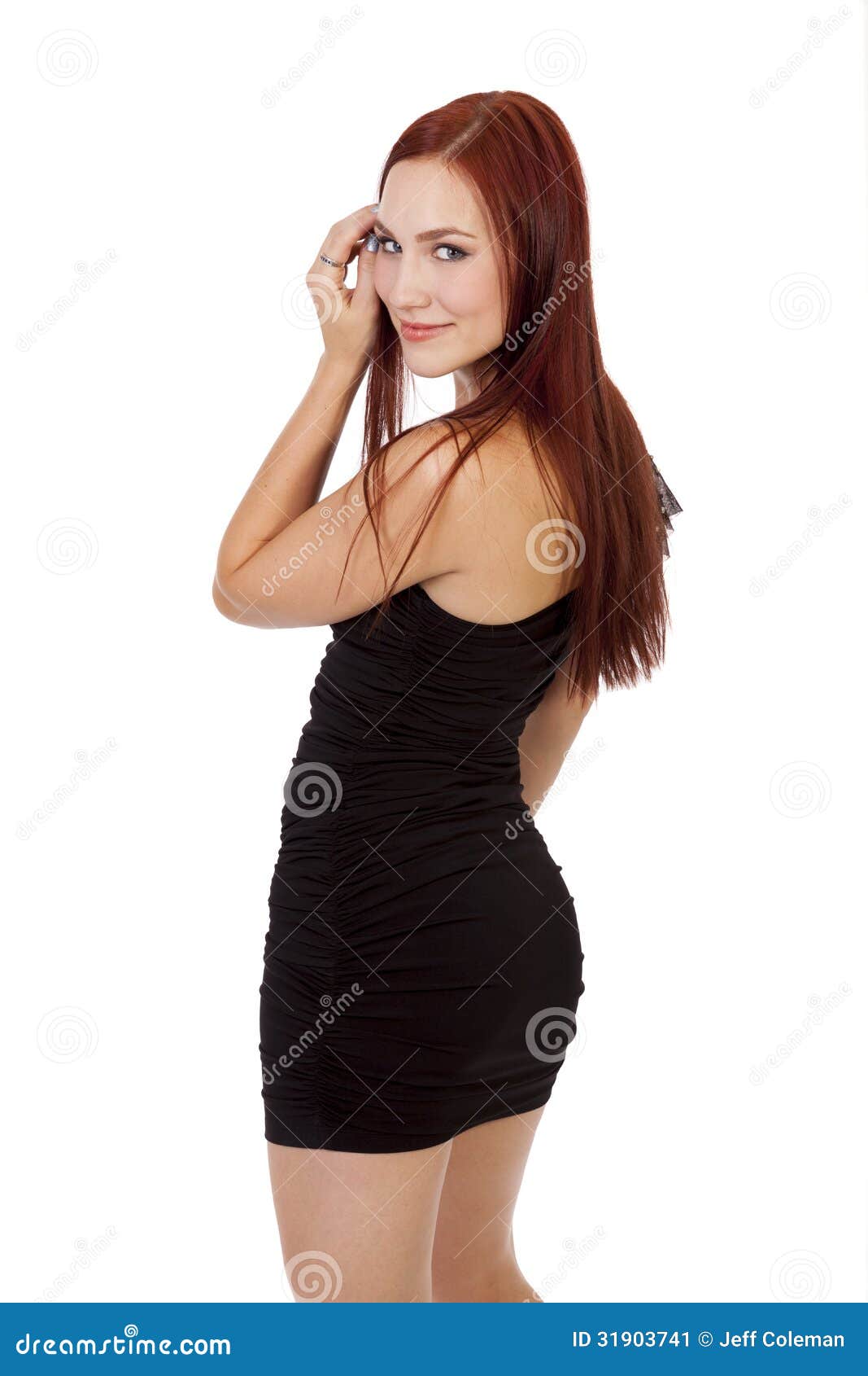 Gorgeous Woman with Red Hair Smiles and Looks Back Over Her Shoulder ...