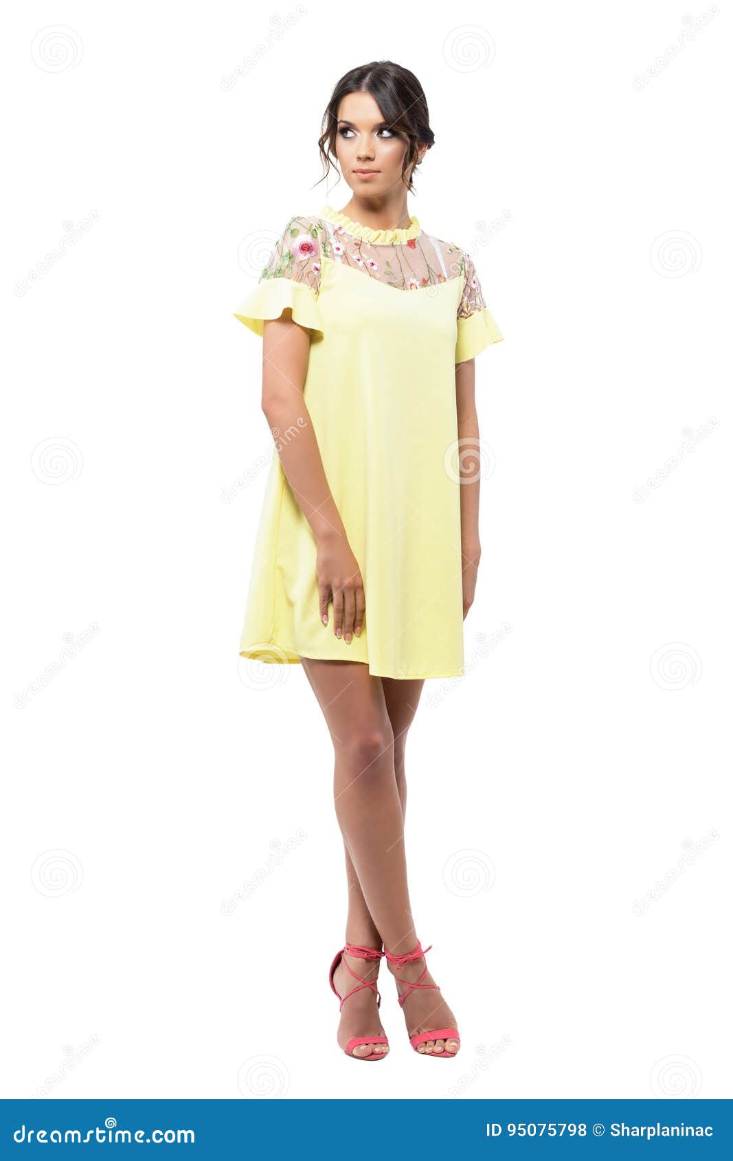 Gorgeous Woman in Yellow Short Summer Dress Posing and Looking Back ...