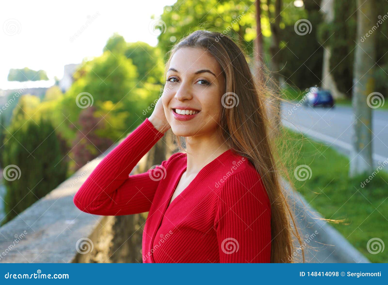 Gorgeous Young Woman With Long Hair Turn The Head And Looking At Camera When Walking In The 