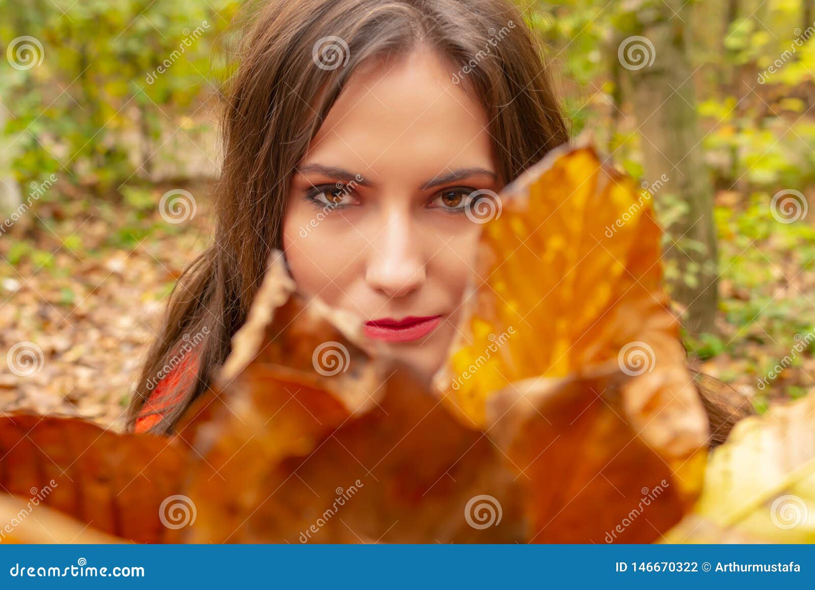Gorgeous Young Woman Outdoors, in a Park Autumn Scenery, Holding Yellow ...