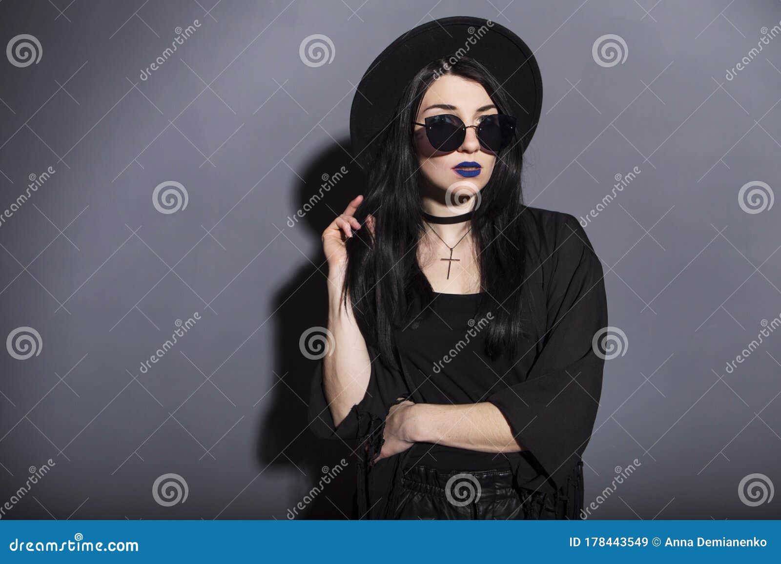 Gothic Caucasian Woman in Dark Dress on a Grey Neutral Background ...