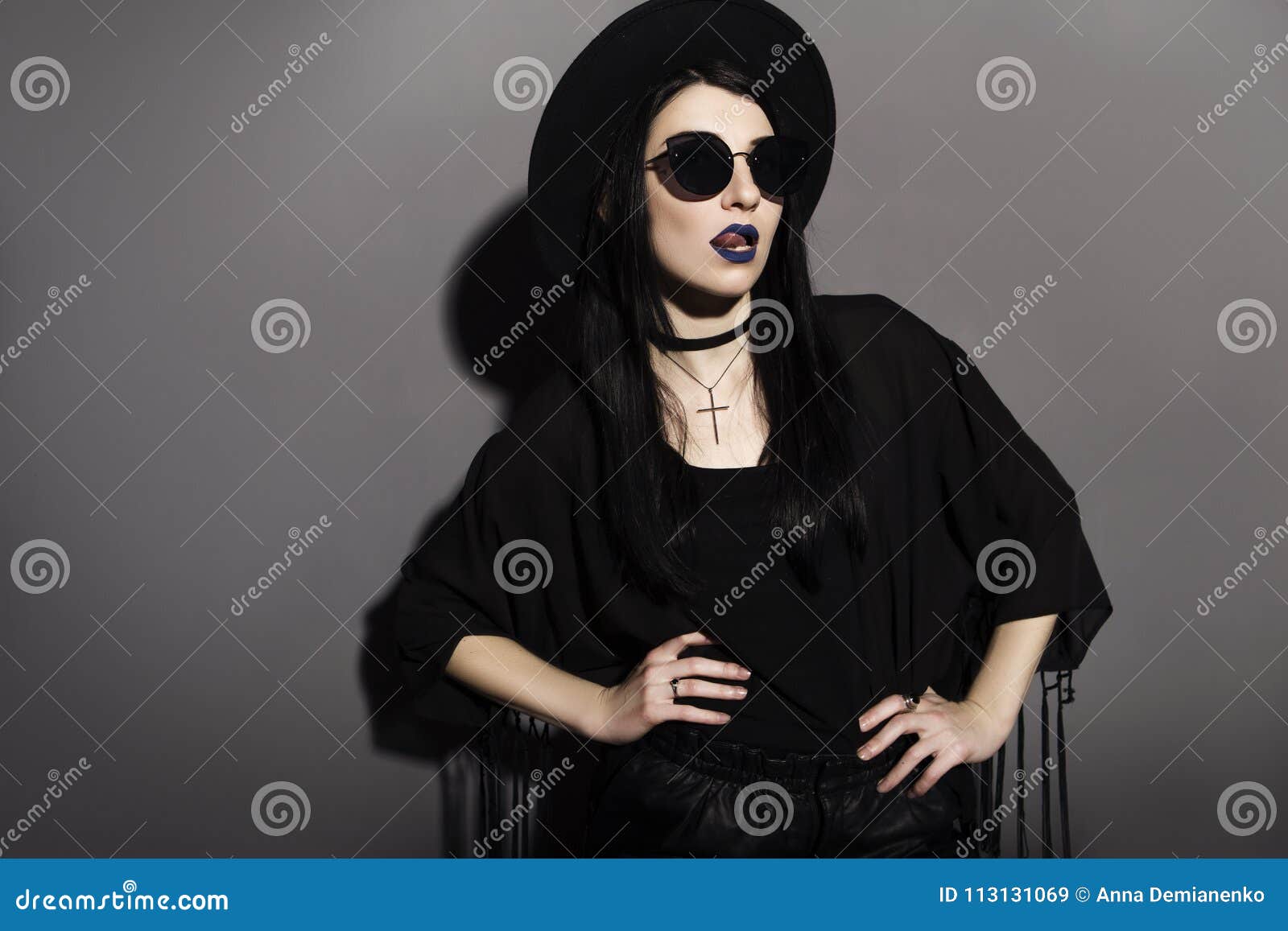 Gothic Caucasian Woman in Dark Dress on a Grey Neutral Background ...