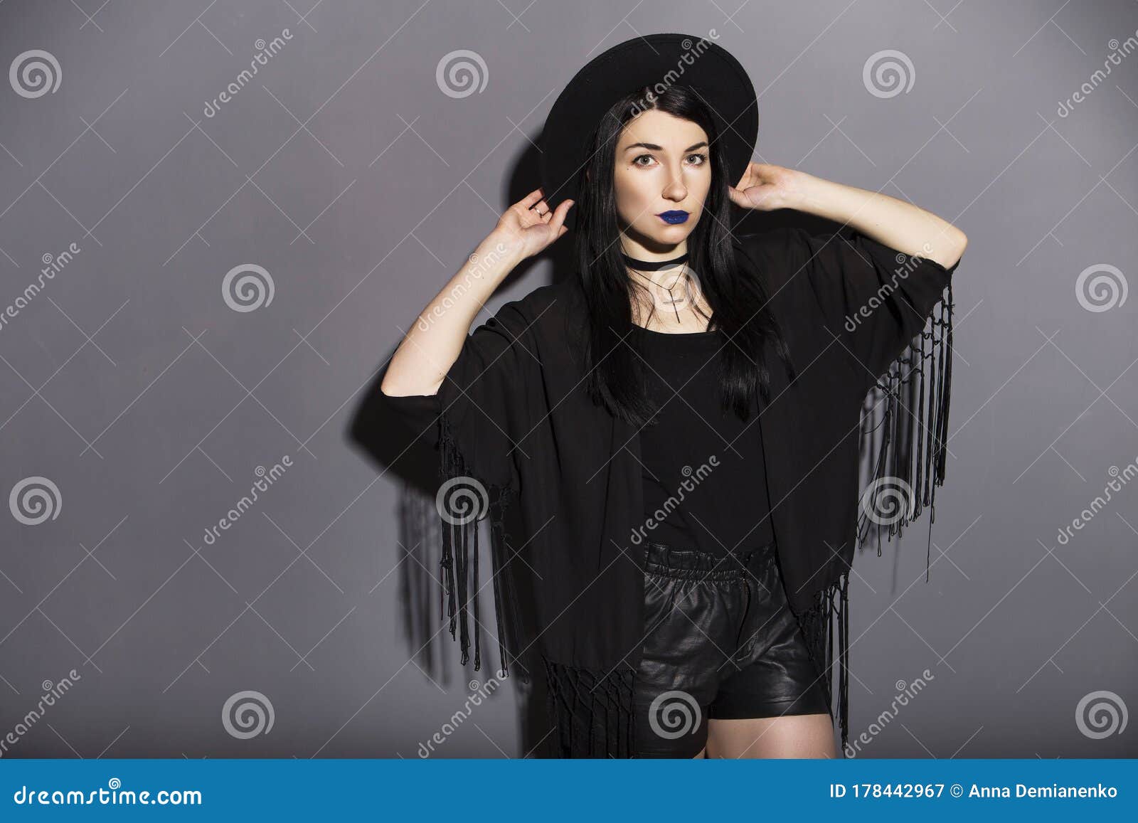 Gothic Caucasian Woman in Dark Dress on a Grey Neutral Background ...