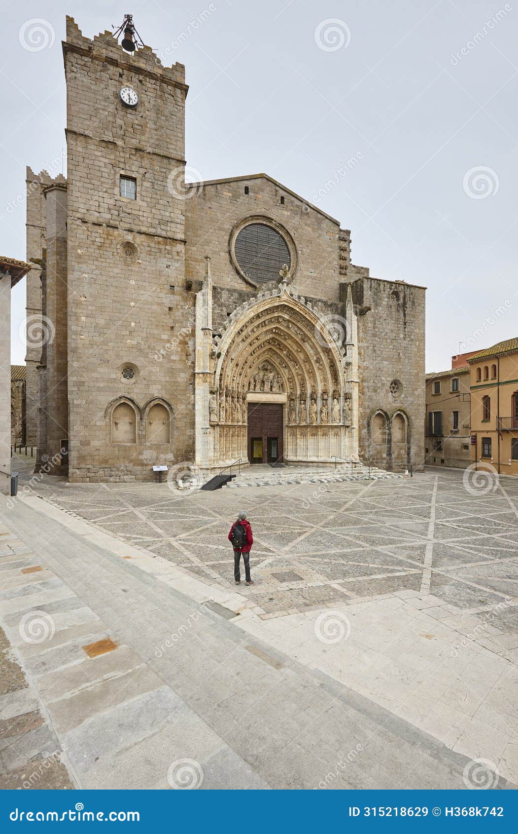 gothic facade church and square. castello de empuries. catalonia, spain