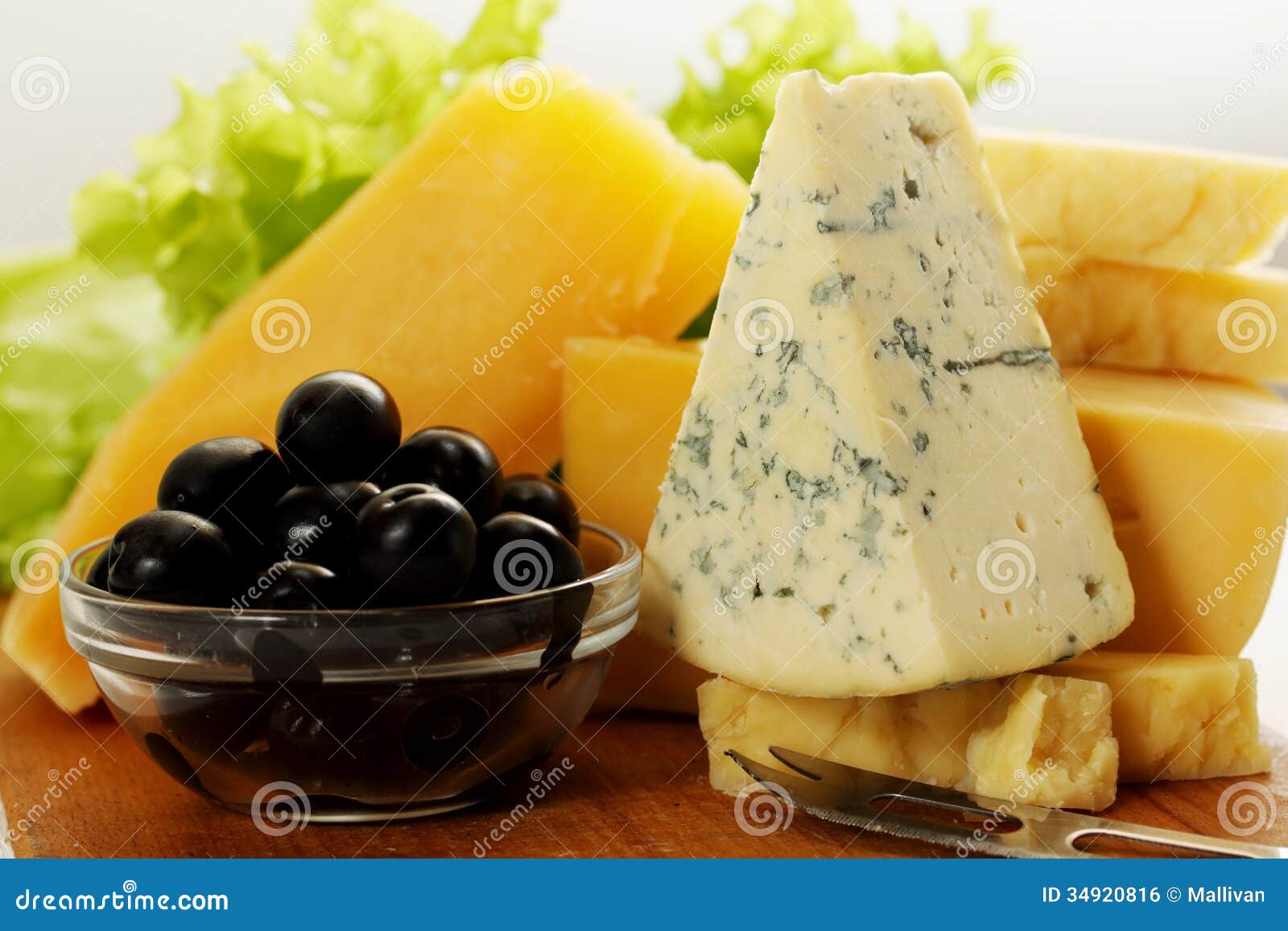 Gourmet cheeses and olives stock photo. Image of appetizer 34920816