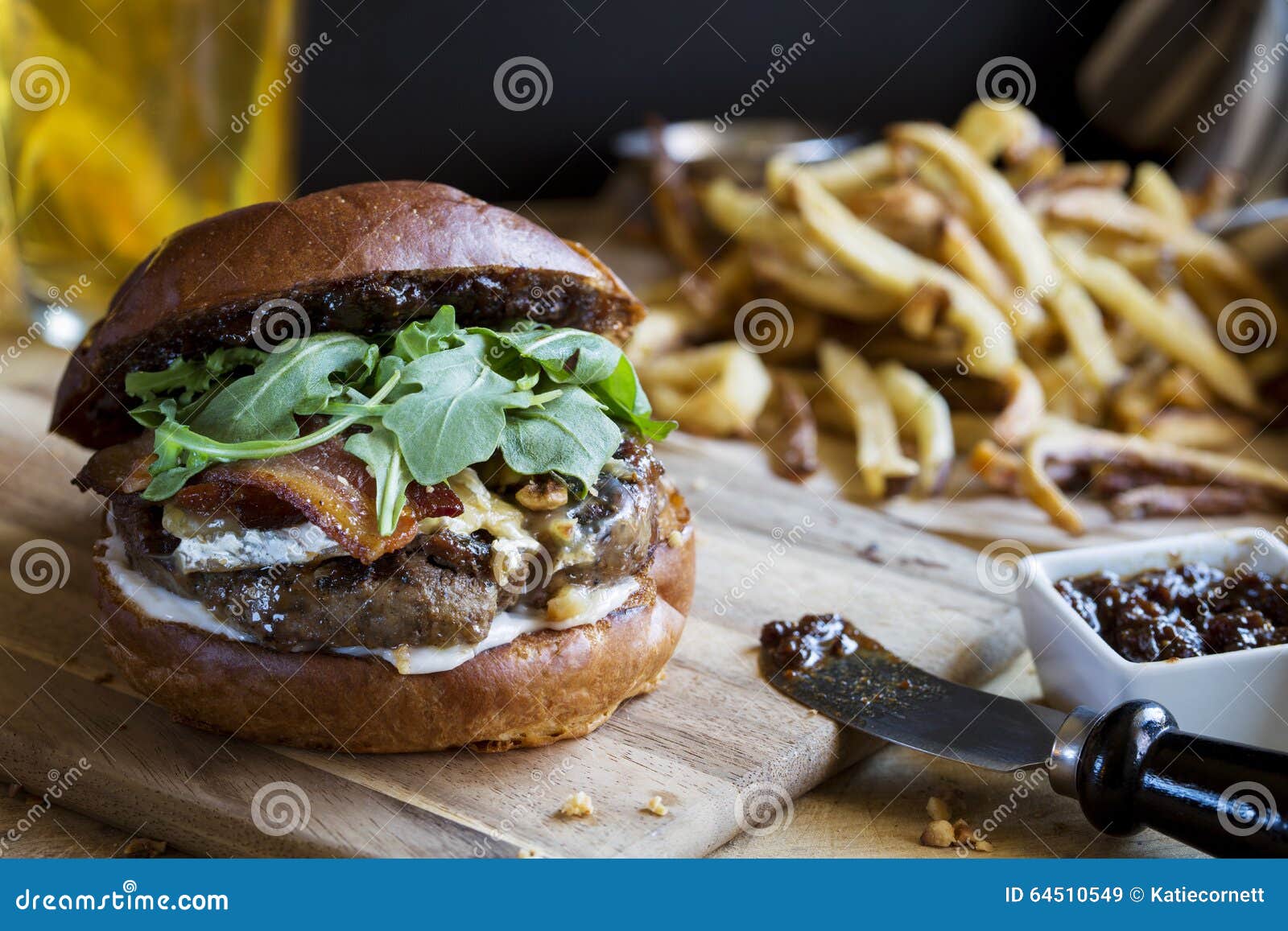 gourmet hamburger with fig jam and french fries