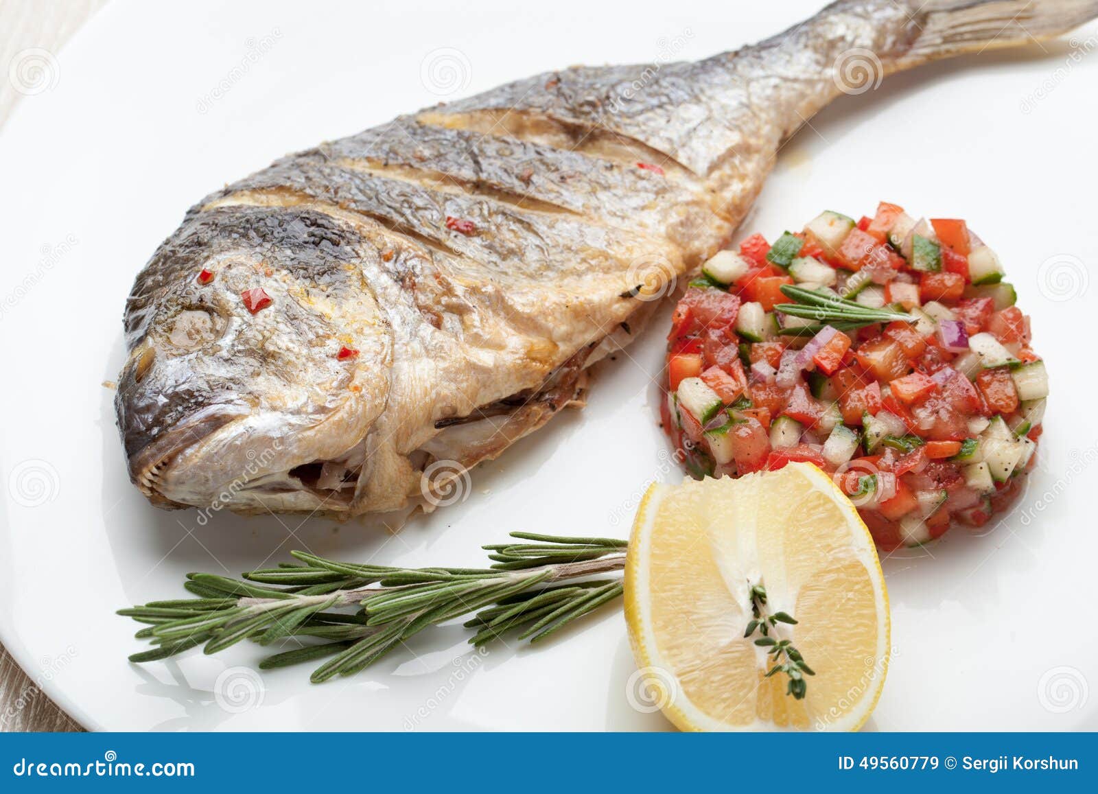 gourmet mediterranean seafood dish. grilled fish gilthead with v