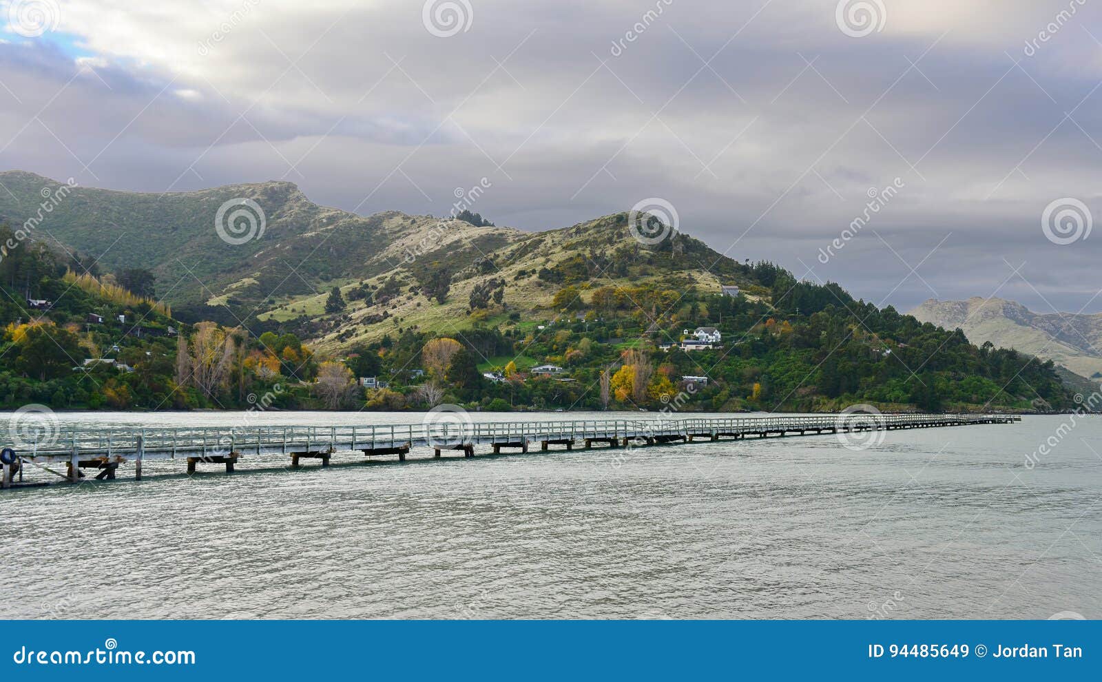 governors bay jetty and port hills in the background in christchurch