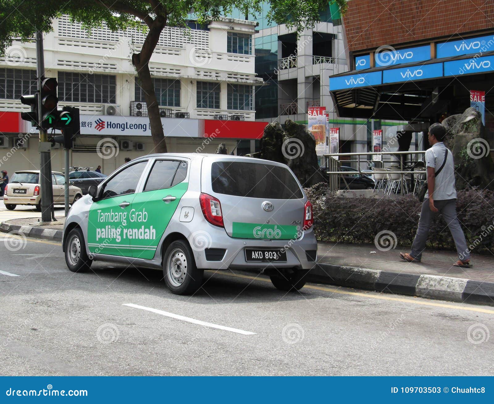 Grab Vehicle With Promotional Ads Painted Around Its Side 