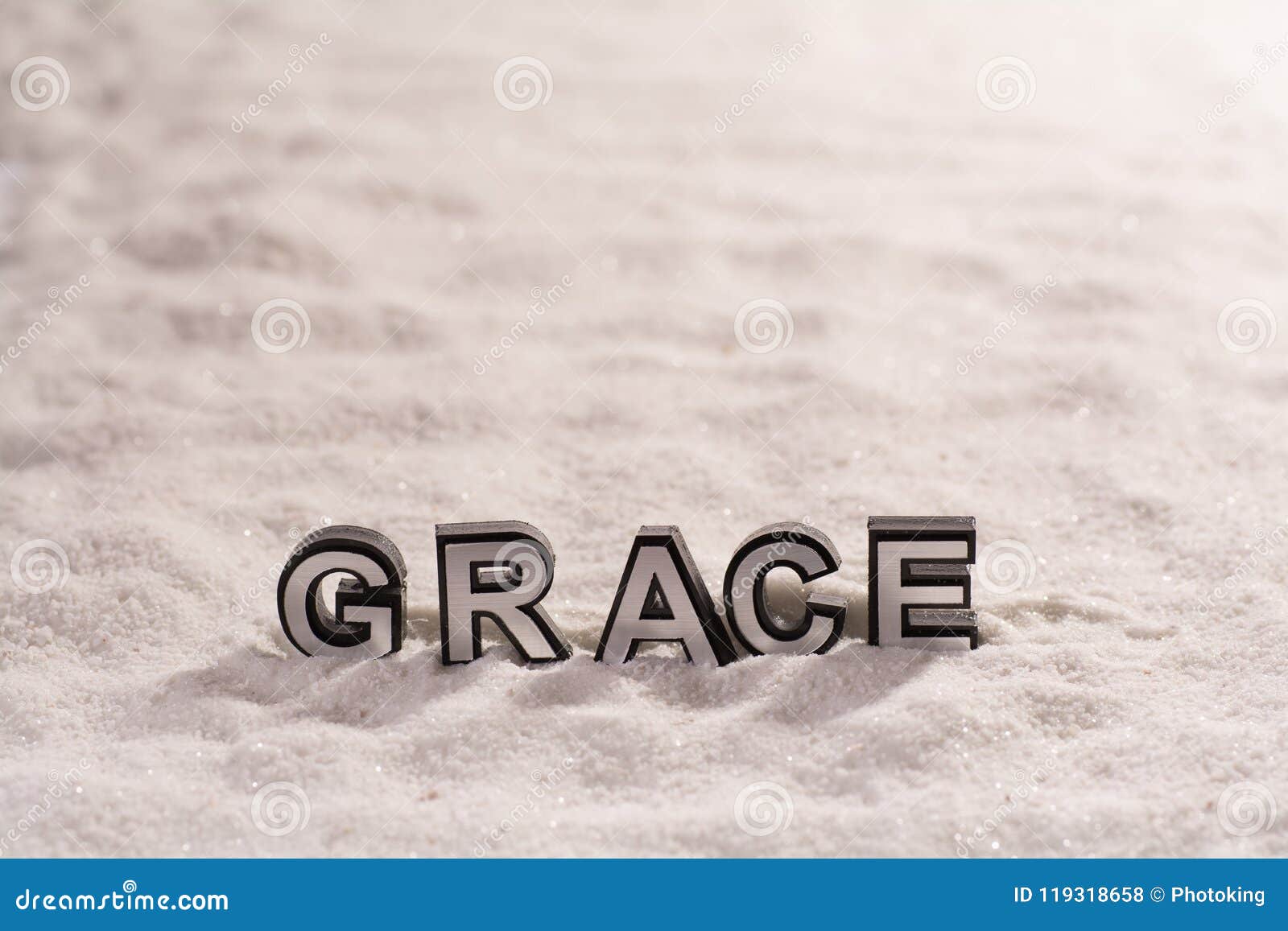 grace word on white sand