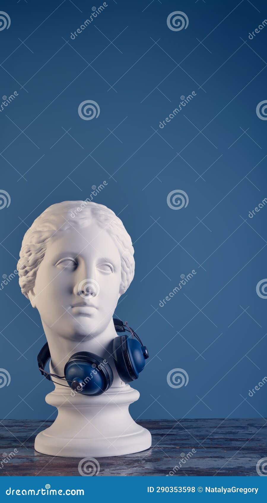 Plaster Bust of a Graceful Aphrodite with Huge Blue Audio Wireless  Headphones Looking at a Black Vinyl Record. Stock Image - Image of bust,  collection: 278539763