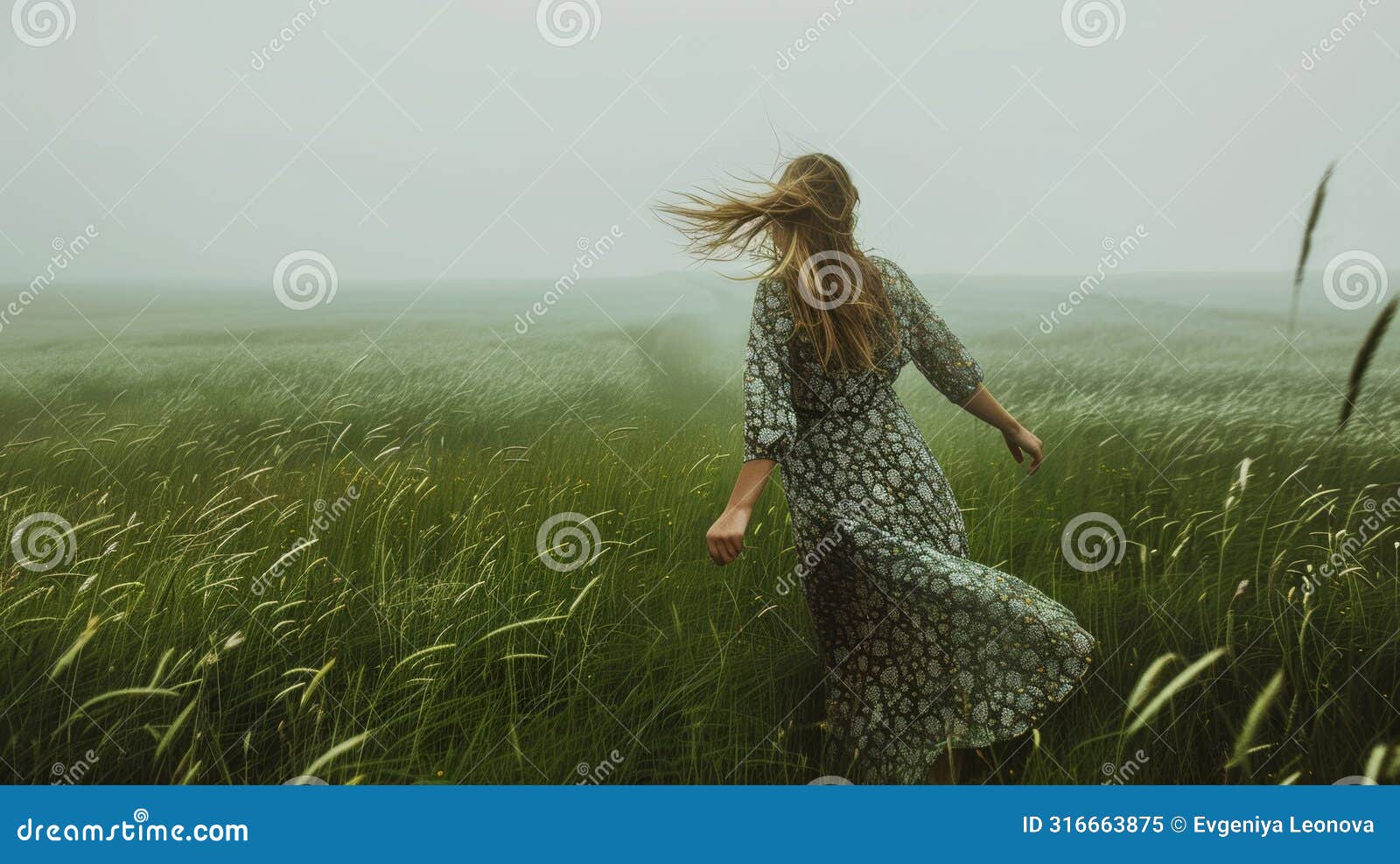 graceful woman in elegant dress strolling through breezy green field with tall grass