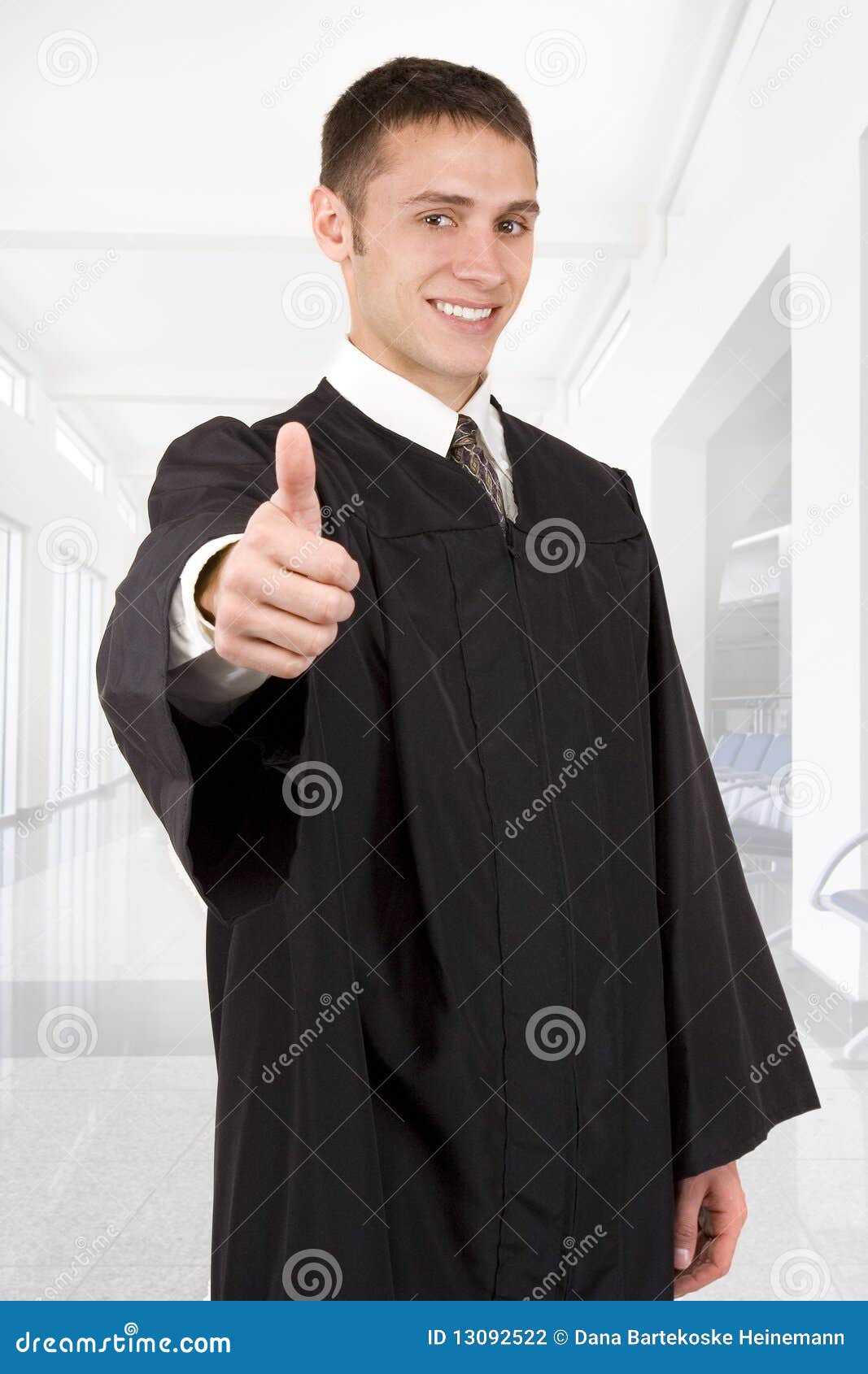 Young male graduate in cap and gown