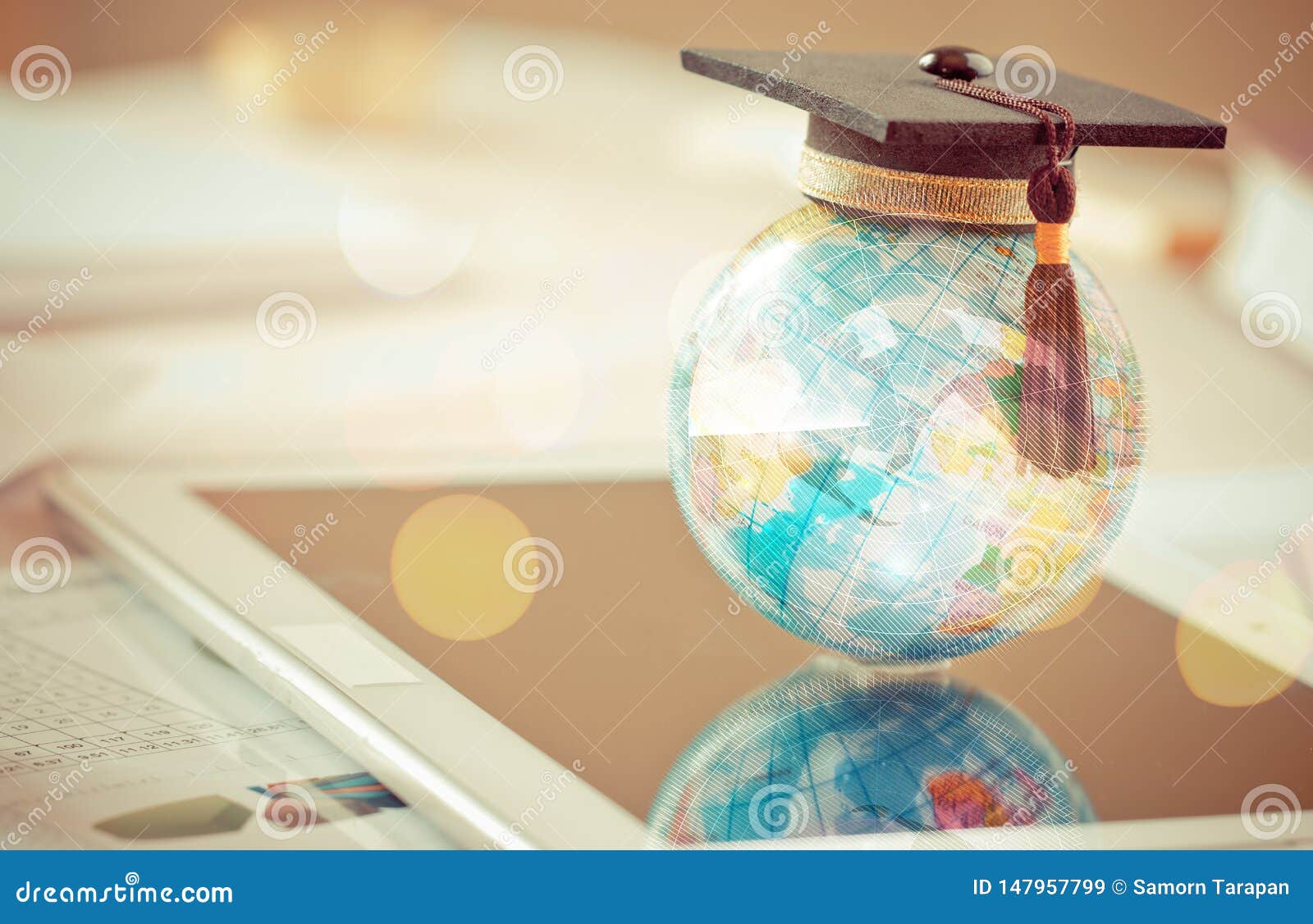 graduate study abroad concept, graduation cap on top earth globe model map on laptop with radar background. graduate study abroad