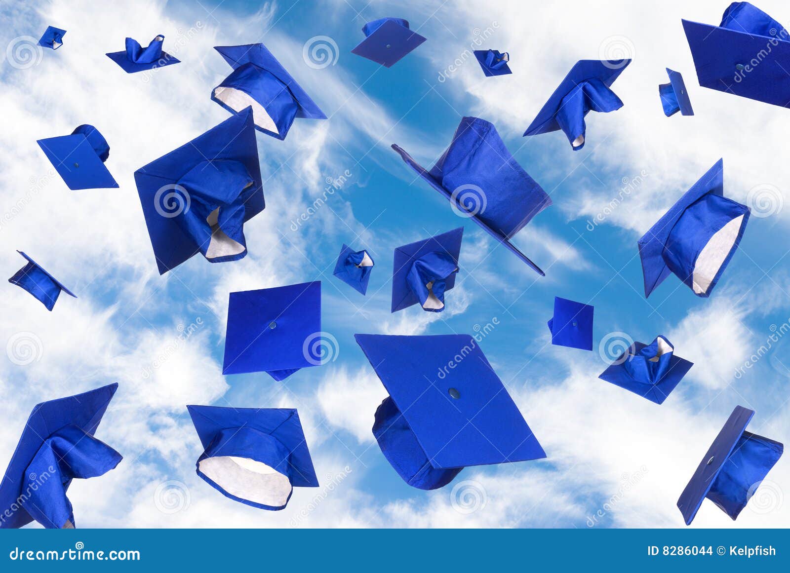 graduation caps in flight
