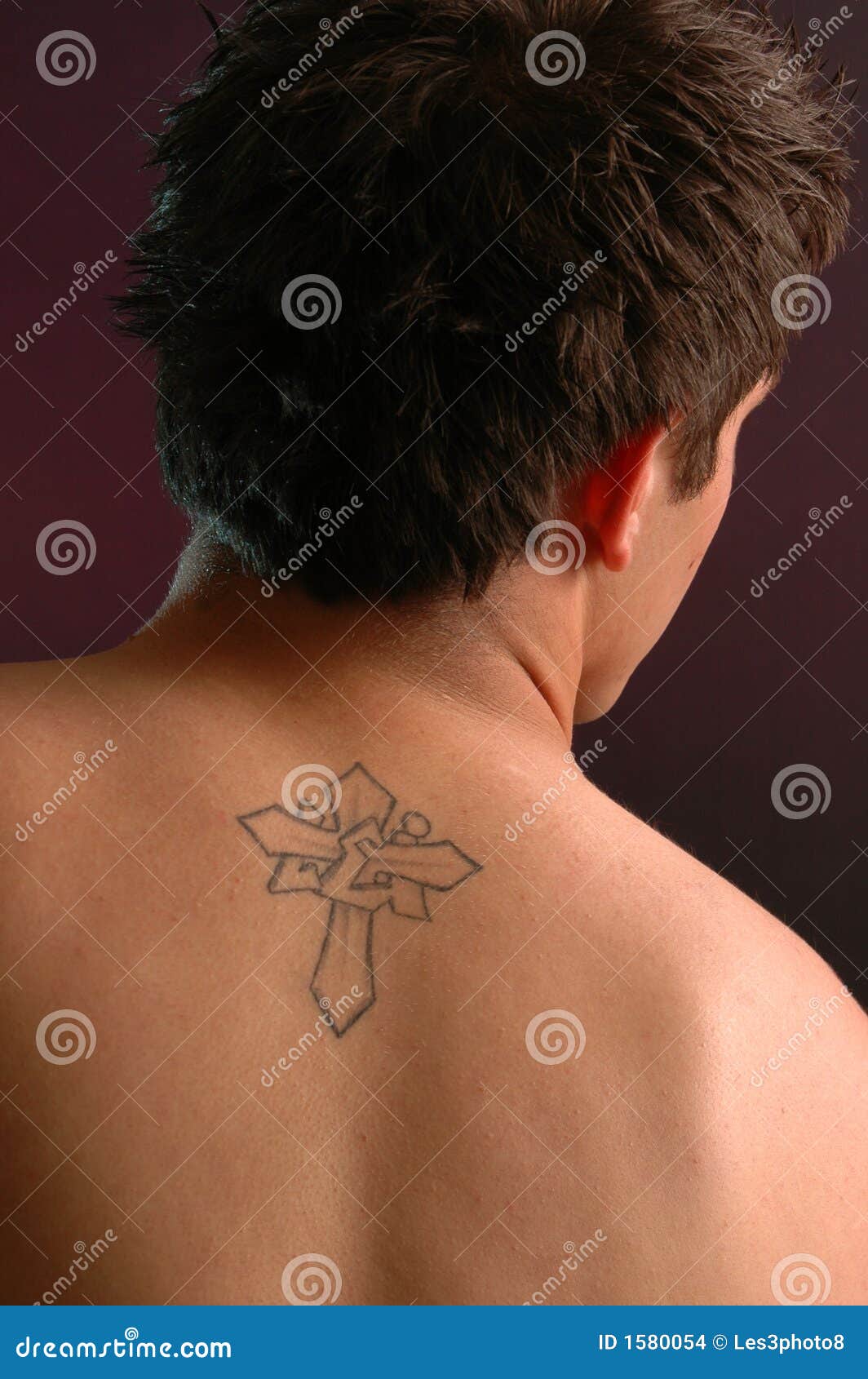 shoulder blade cross tattoos for men