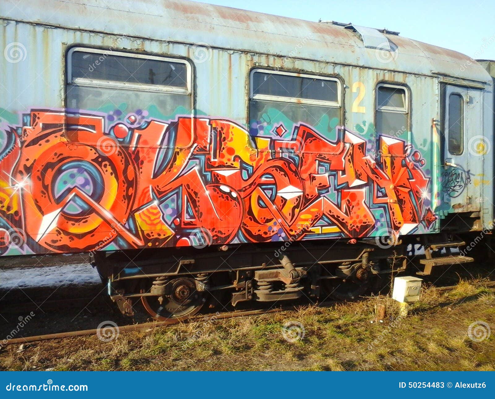 Graffiti on the trains editorial stock photo. Illustration of city