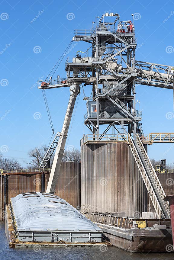 Grain Elevator Terminal Spout Loading Corn into Barge on Mississippi