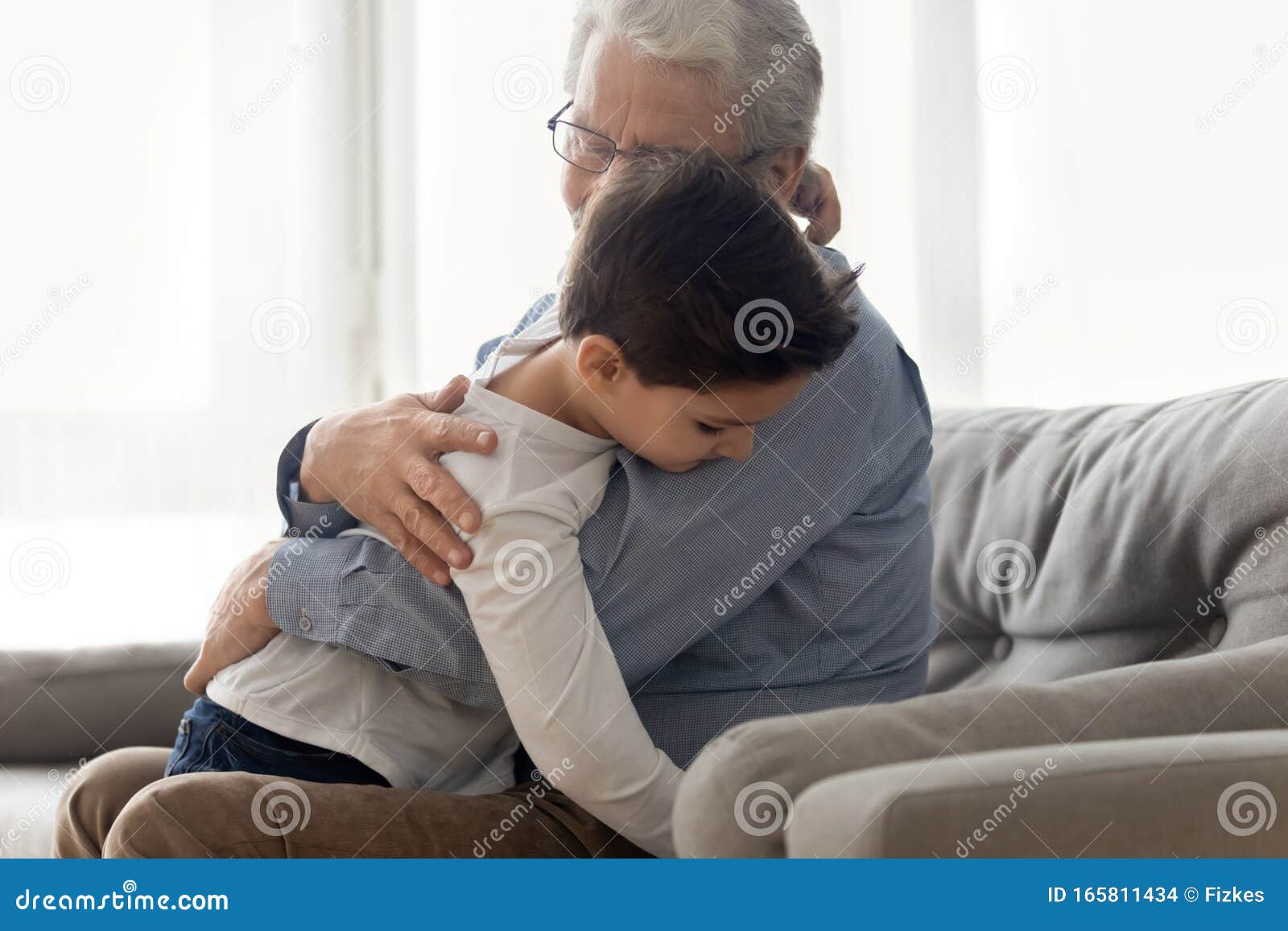 grandfather embraces grandchild enjoy moment of caress and tenderness