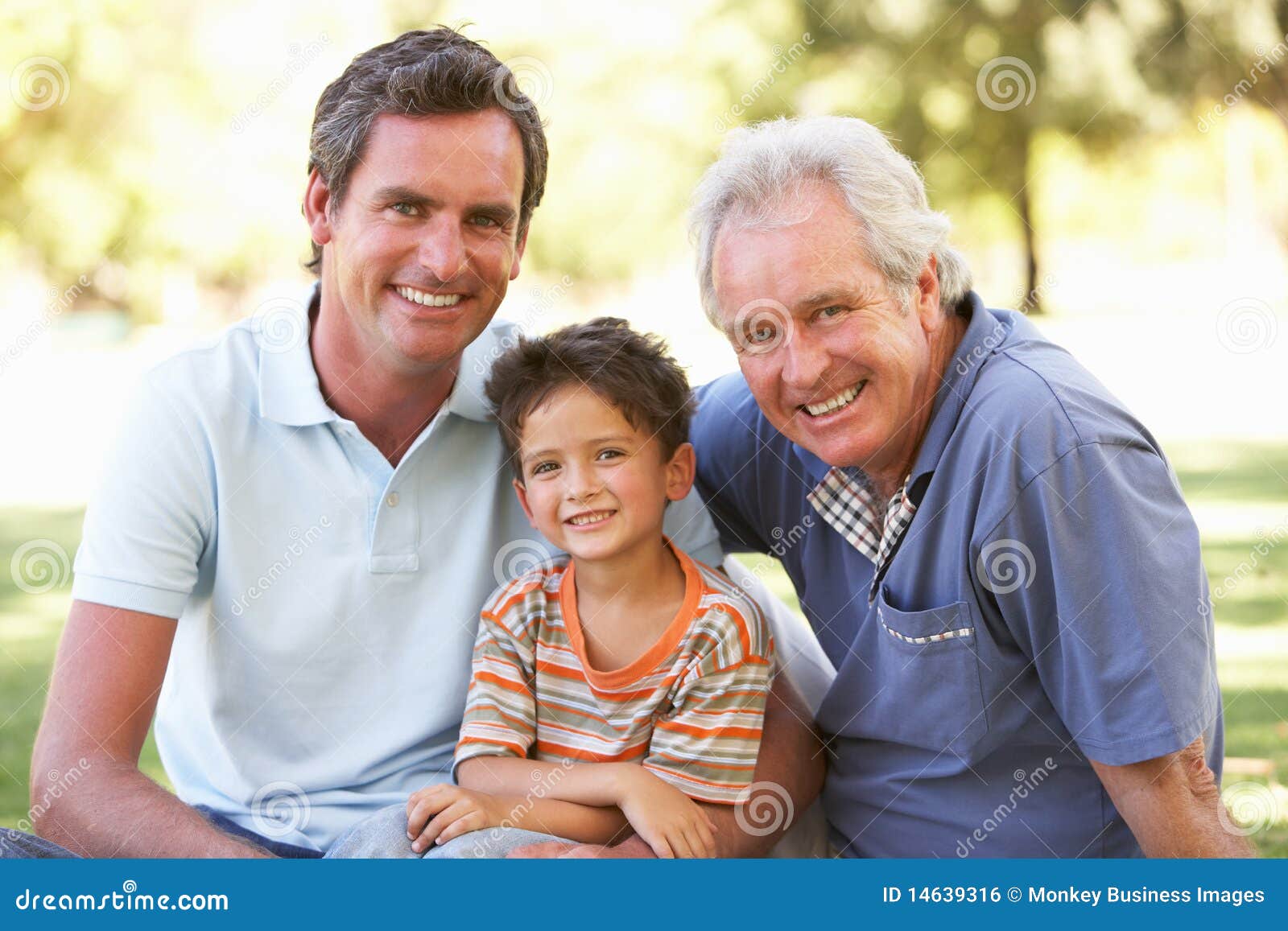 grandfather with father and son in park