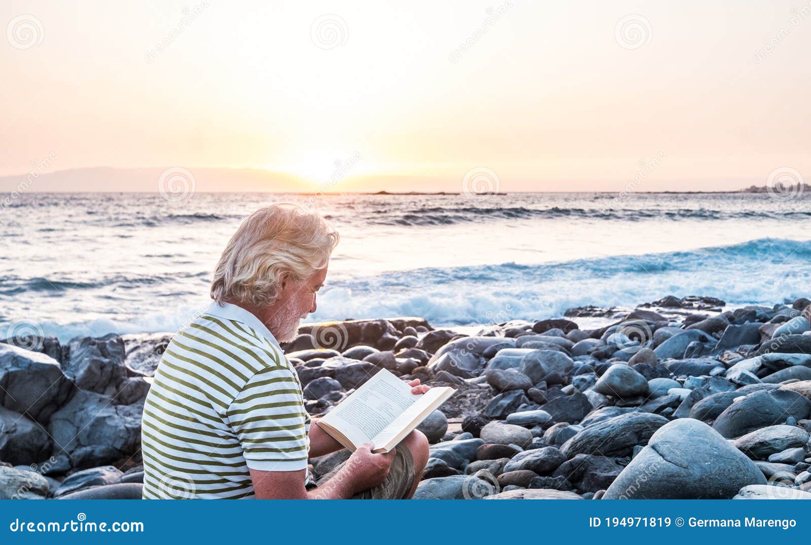 Grandfather People Sitting on the Pebble Beach Reading a Book. White ...