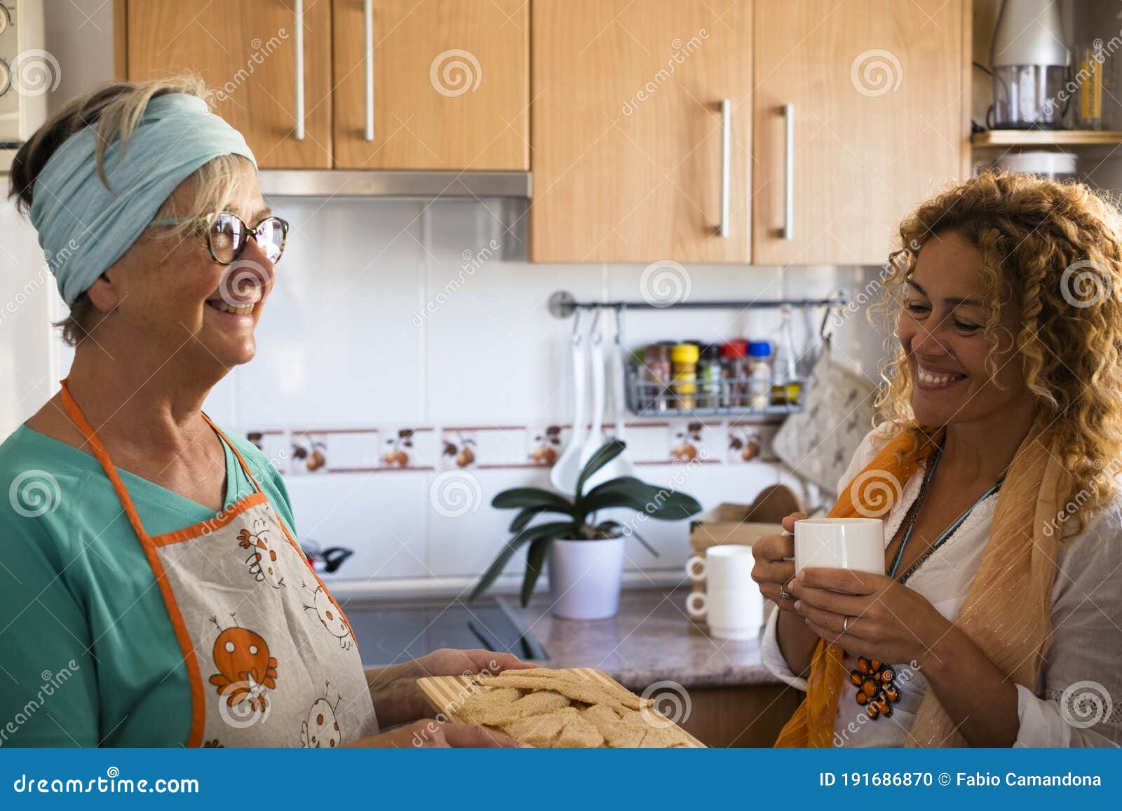 Grandma and Daughter at Home Cooking and Smiling - Enjoying and Have ...