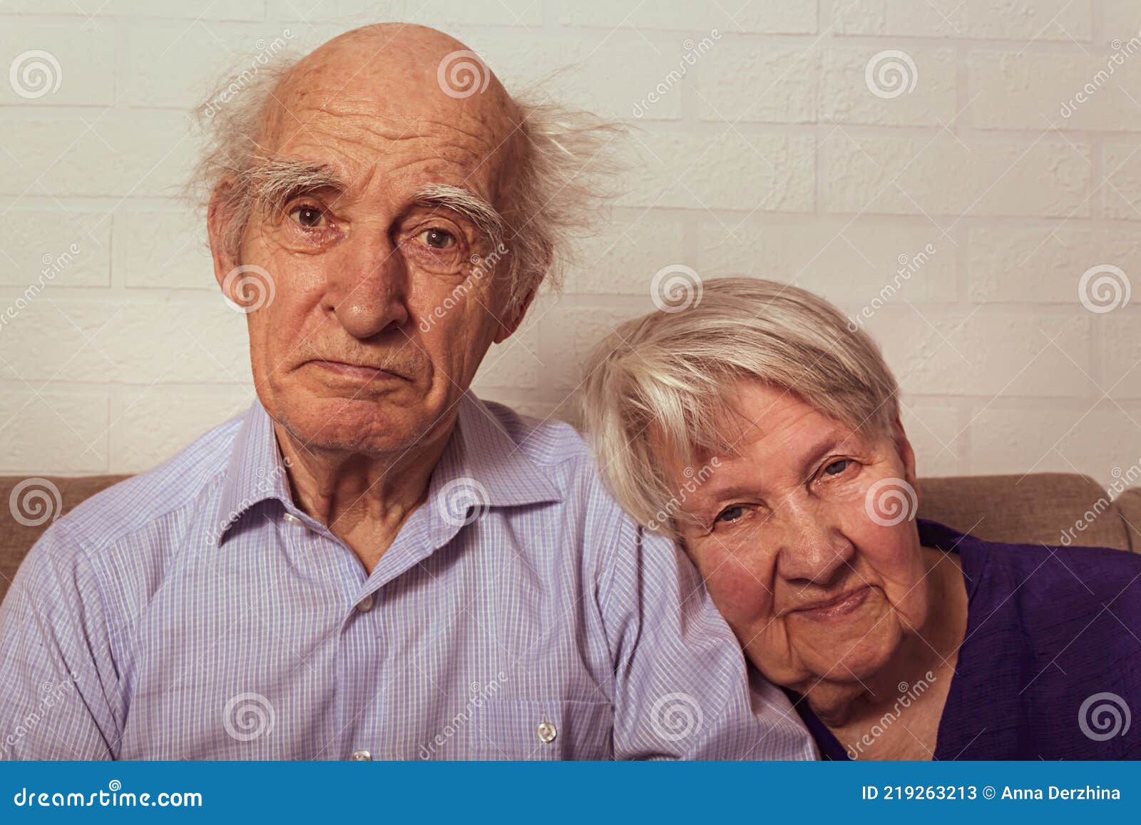 Grandma And Grandpa Cuddling Together On Couch Stock Image Image Of