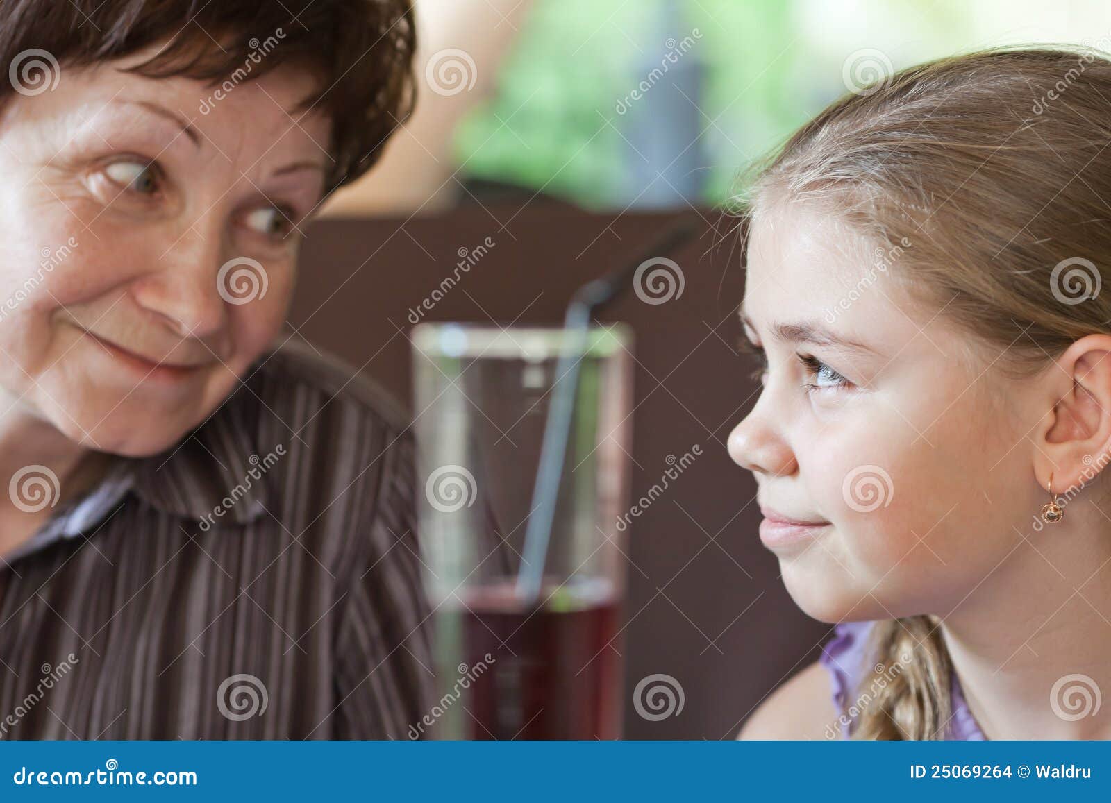 grandma smiling to her granddaughter