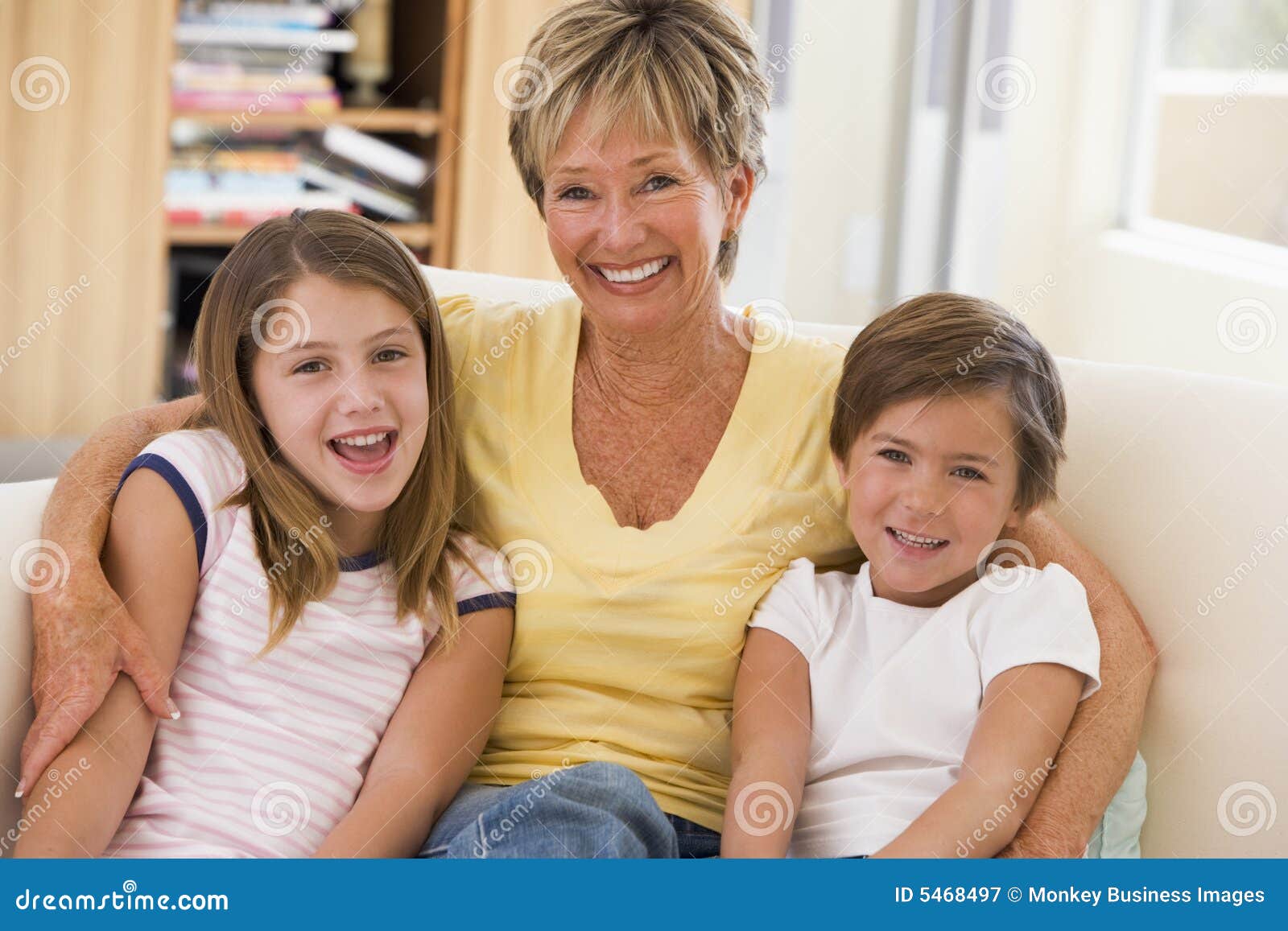 grandmother posing with grandchildren